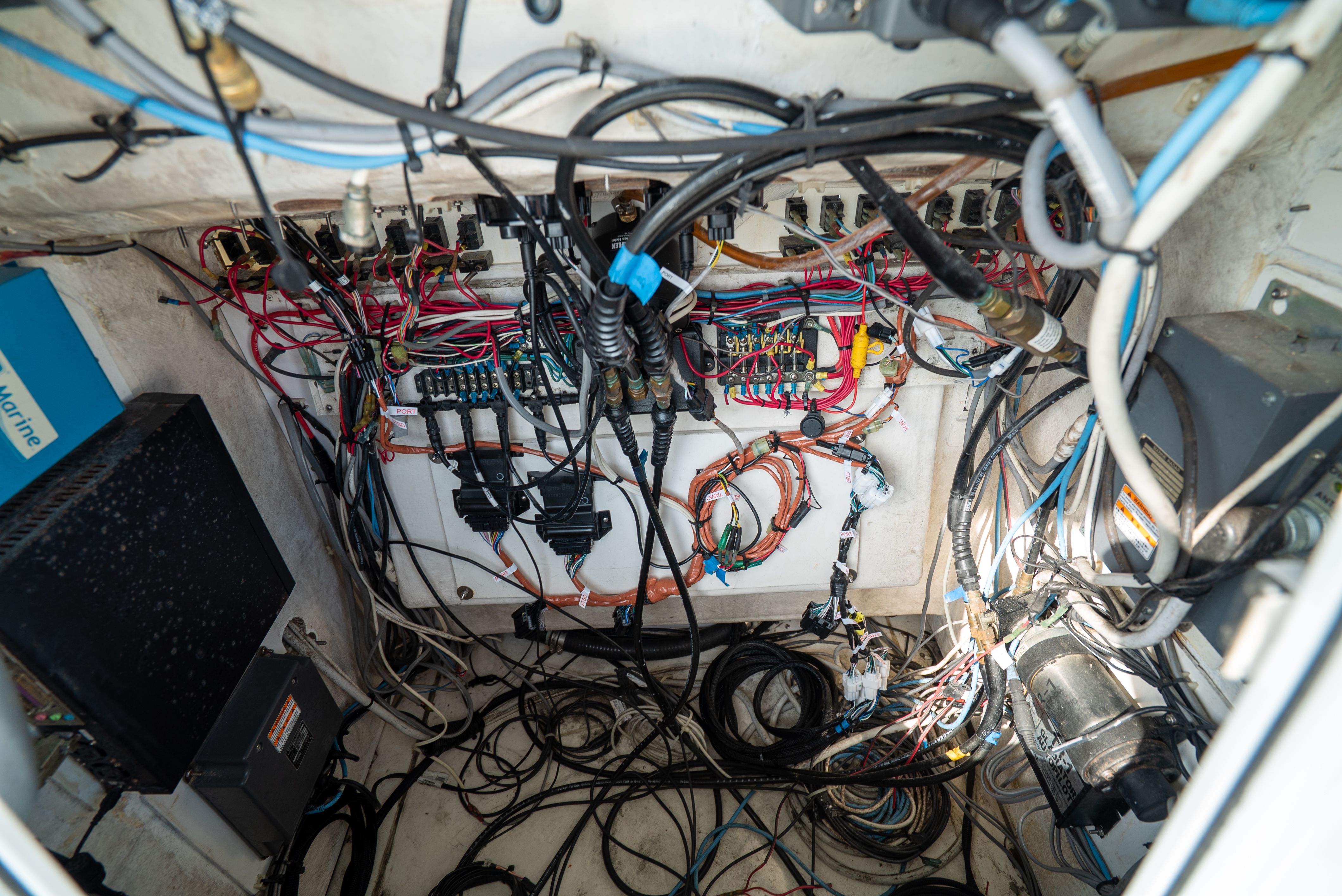 Electrical wiring in the engine room of a 2006 Tempest Offshore 40.