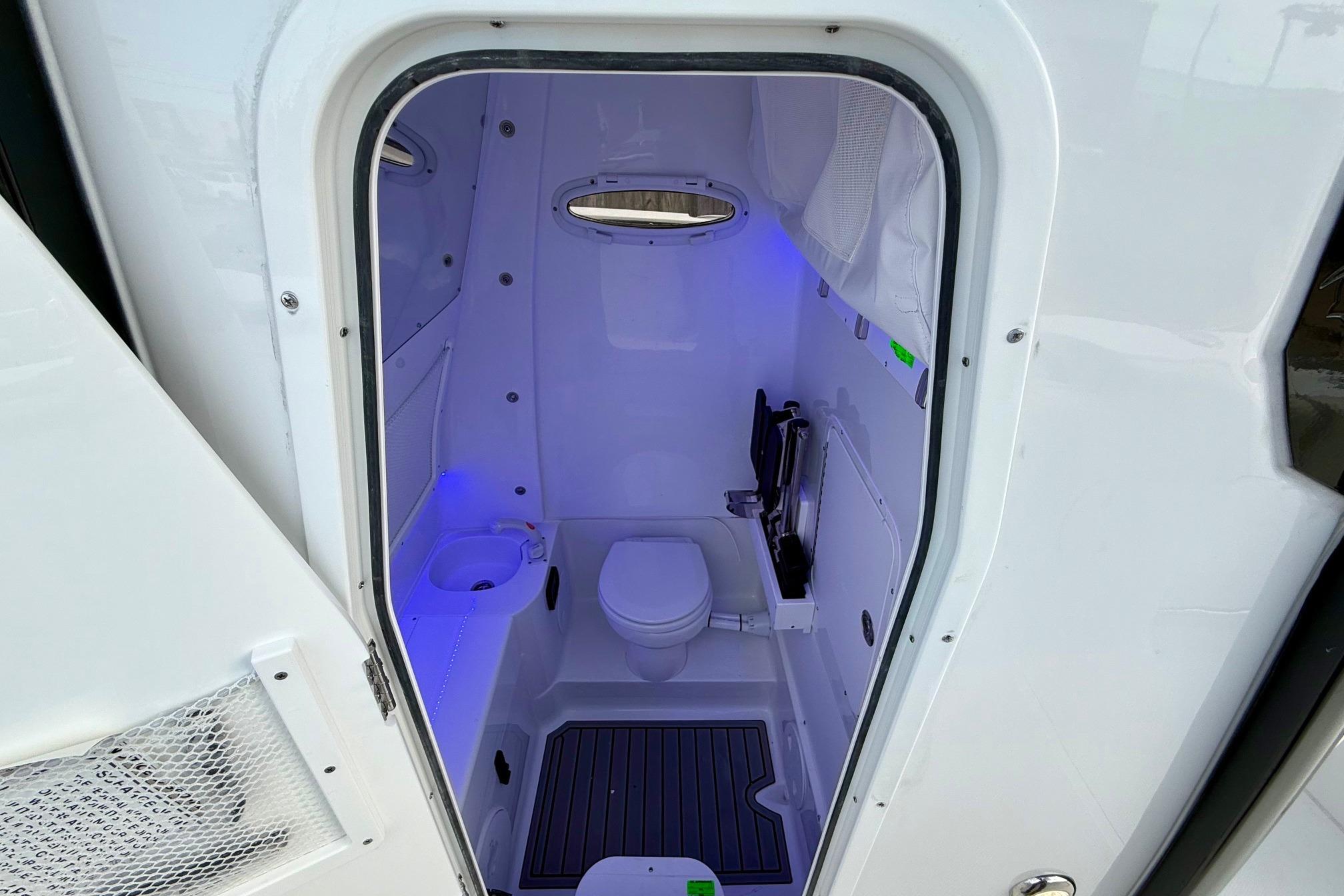 2026 Sea Hunt Gamefish 30 Coffin Box boat interior with modern bathroom amenities.