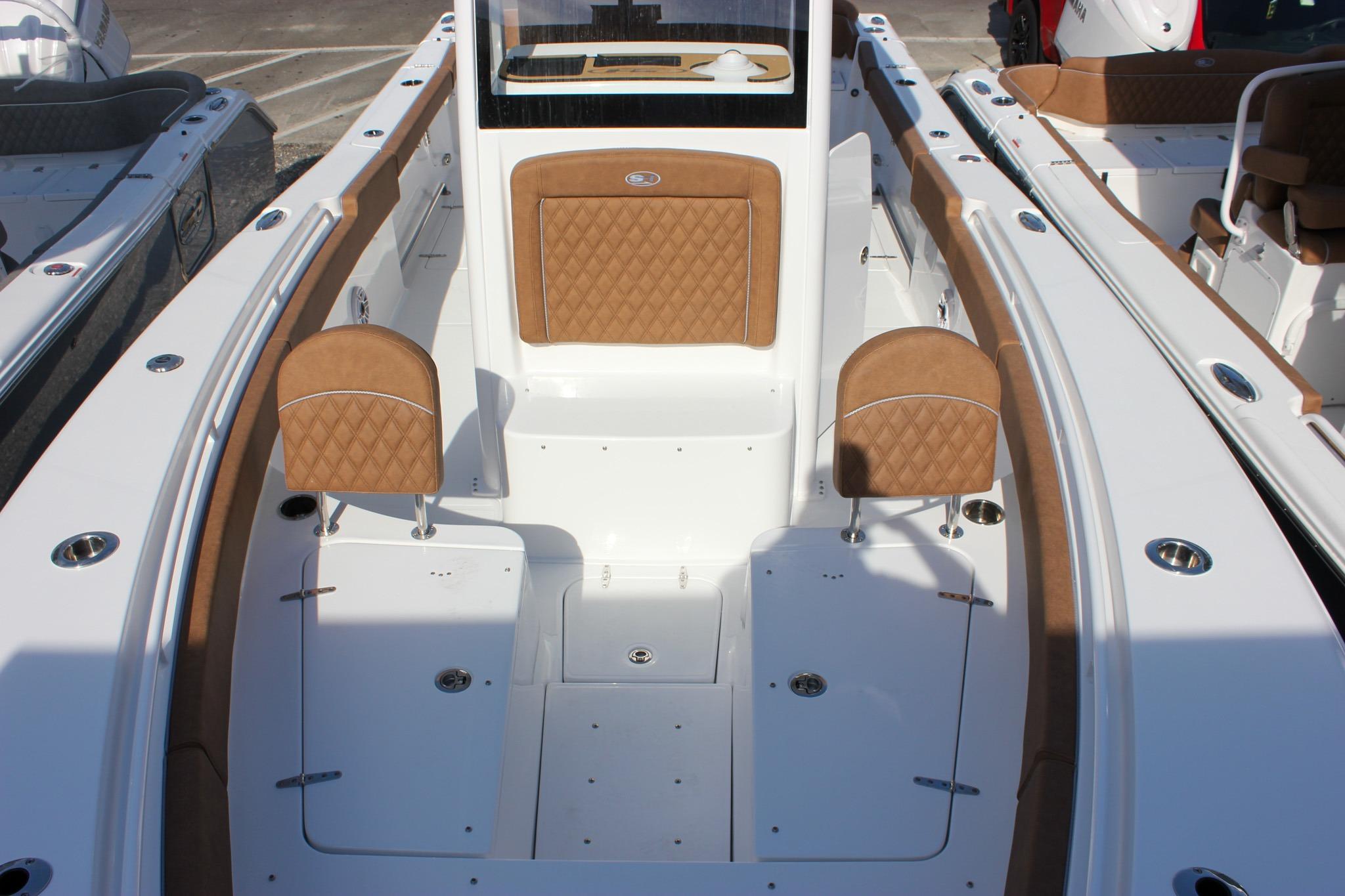 2027 Sea Hunt Ultra 275 SE boat interior with tan seating and white deck.
