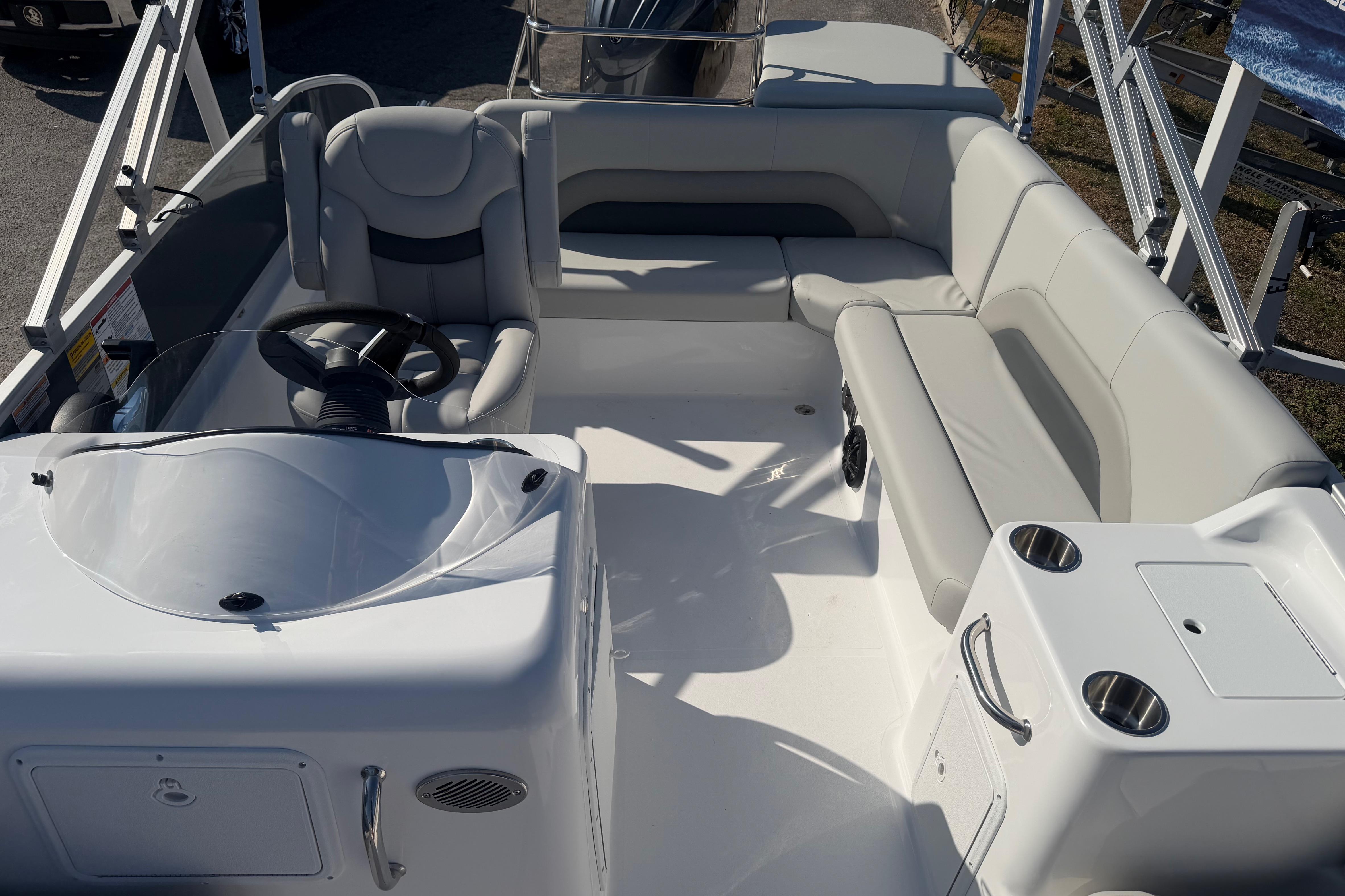 2026 Hurricane FunDeck 198 RE OB boat interior with seating and steering console.