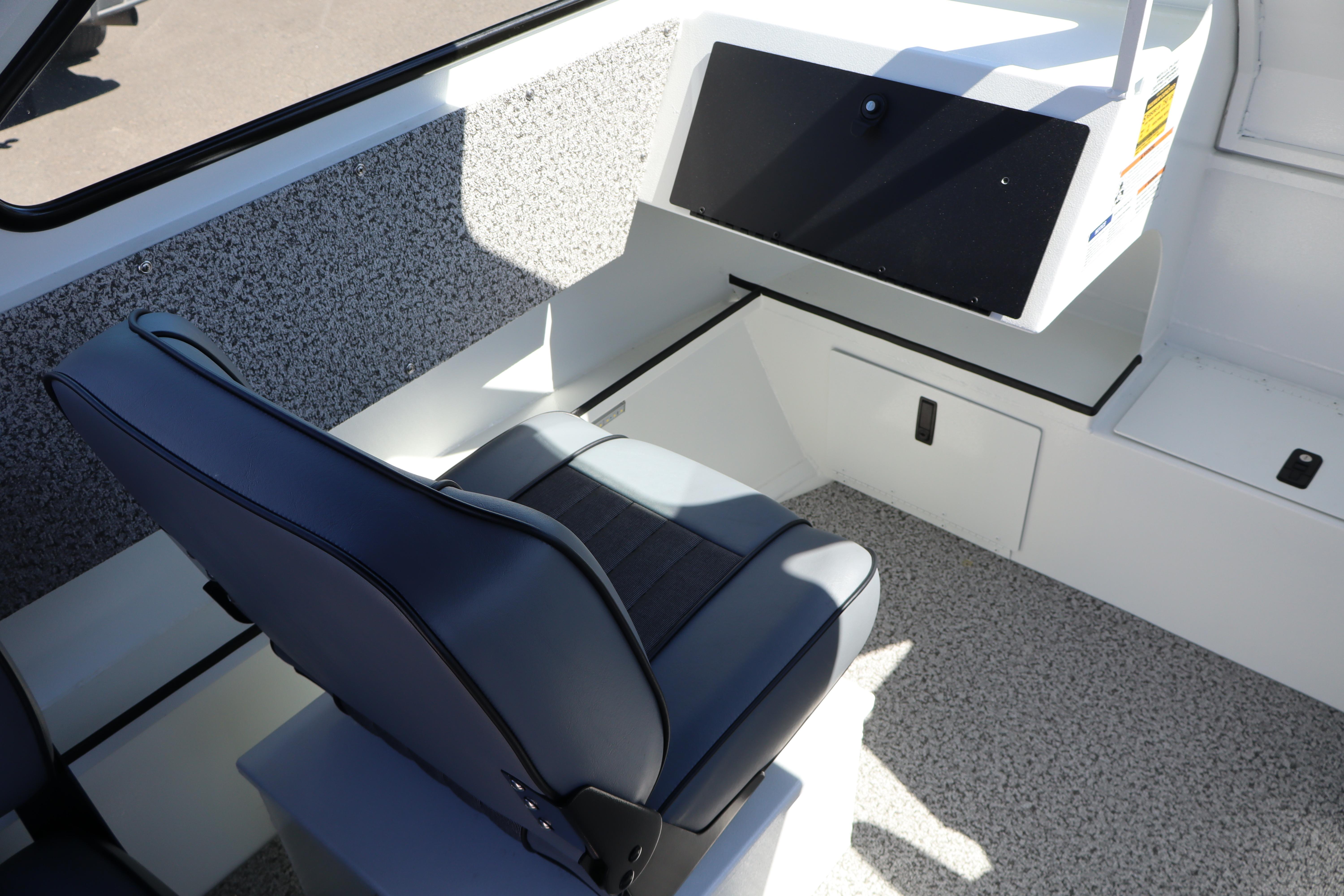 Interior of 2026 Alumaweld Stryker 202 boat with seating and storage compartments.