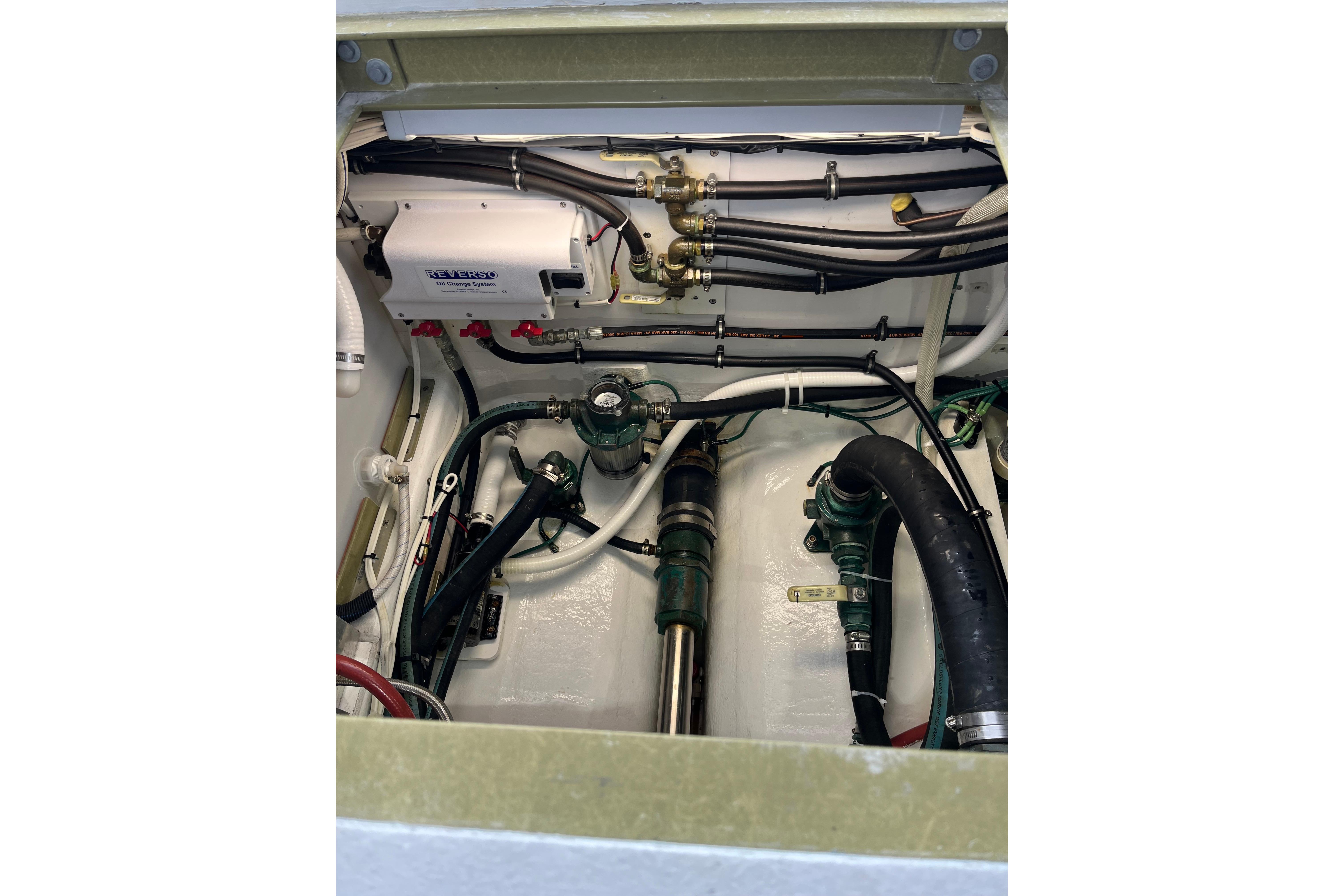 Engine compartment of a 2018 H&H Marine Osmond Beal boat, showcasing mechanical components.