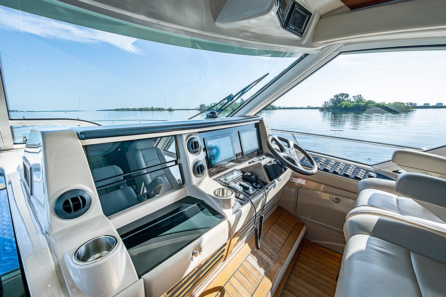 Helm of 2008 Sea Ray 60 Sundancer yacht with modern controls and scenic water view.