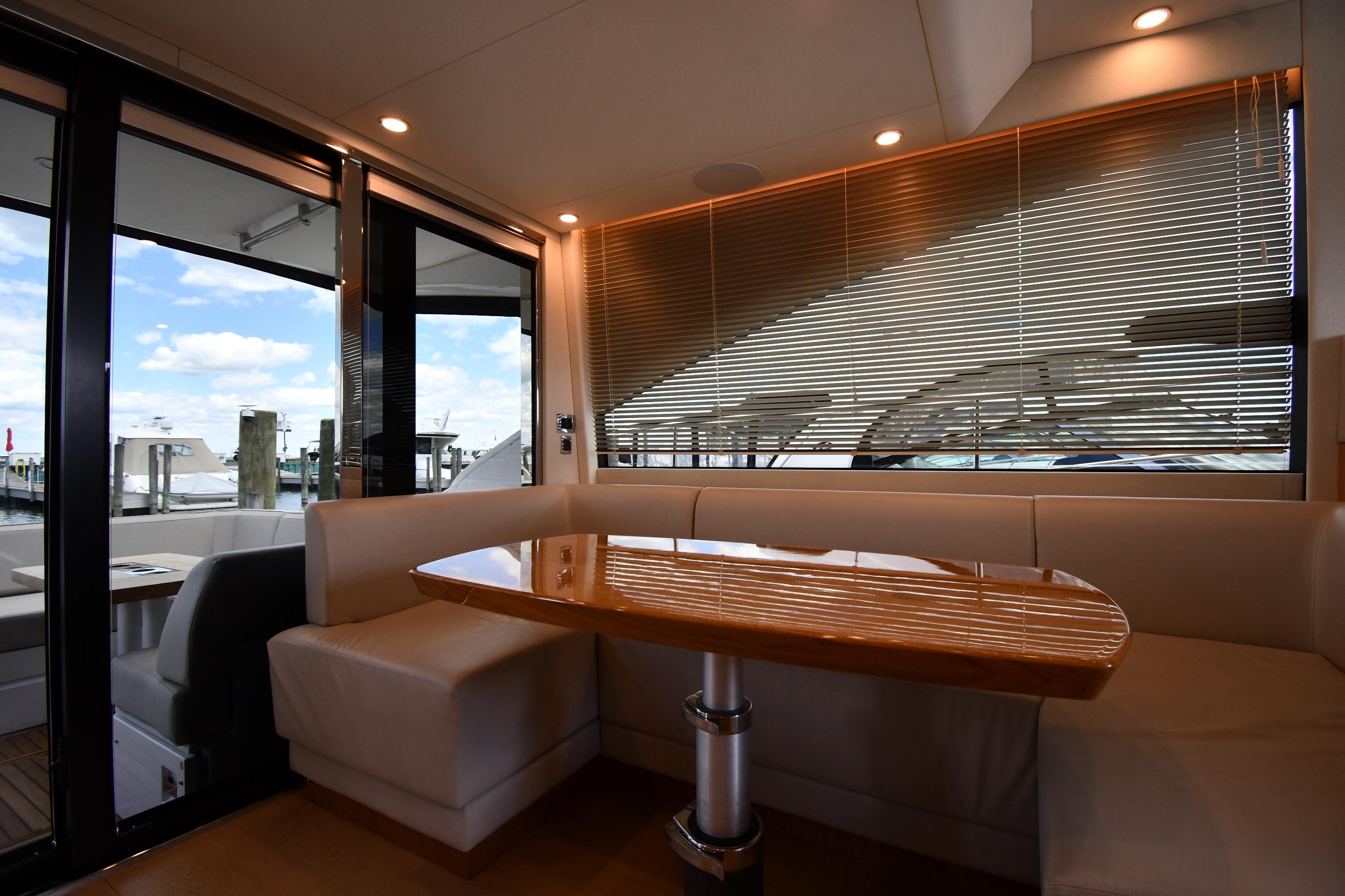 Luxurious interior of 2024 Fairline G50 Targa yacht with elegant dining area.
