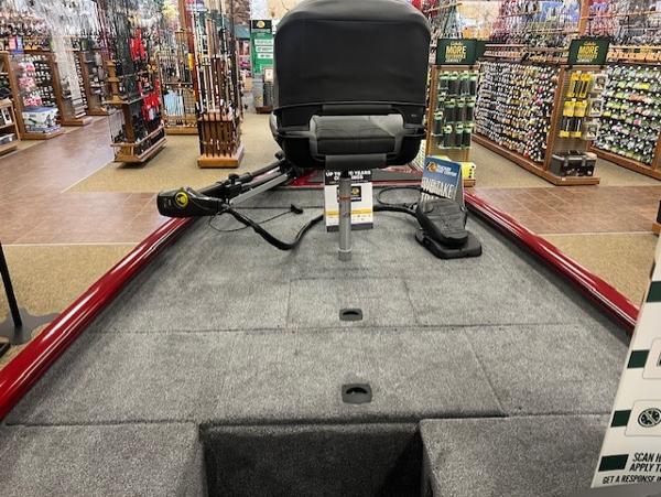 2025 Tracker Pro 170 boat interior in a store, featuring fishing equipment and accessories.