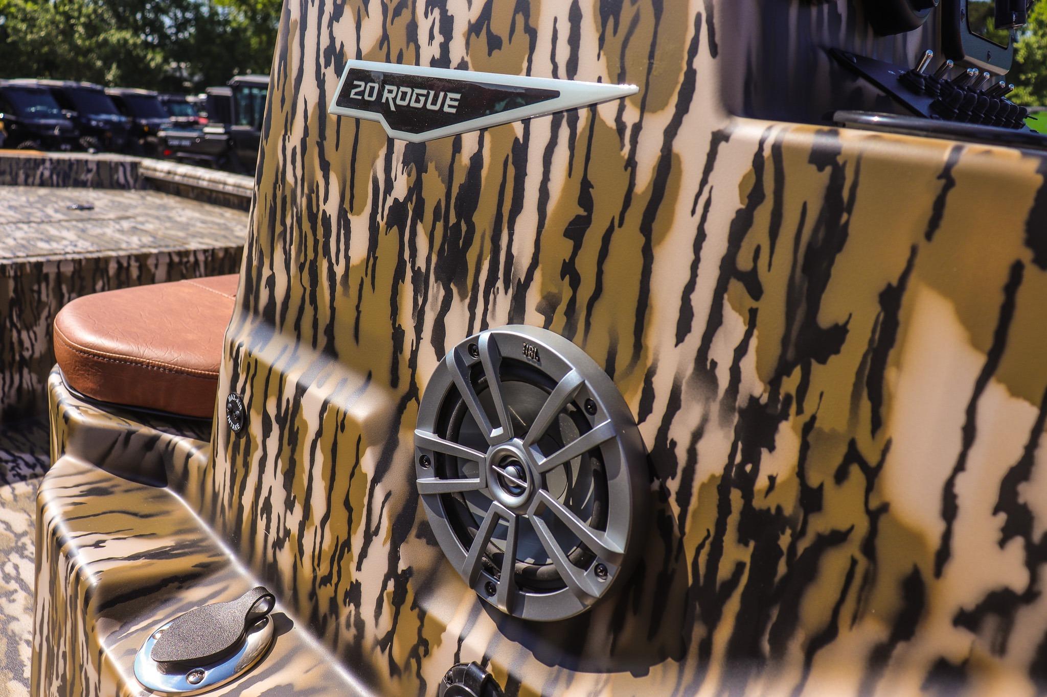 Close-up of a boat with camouflage pattern and speaker.