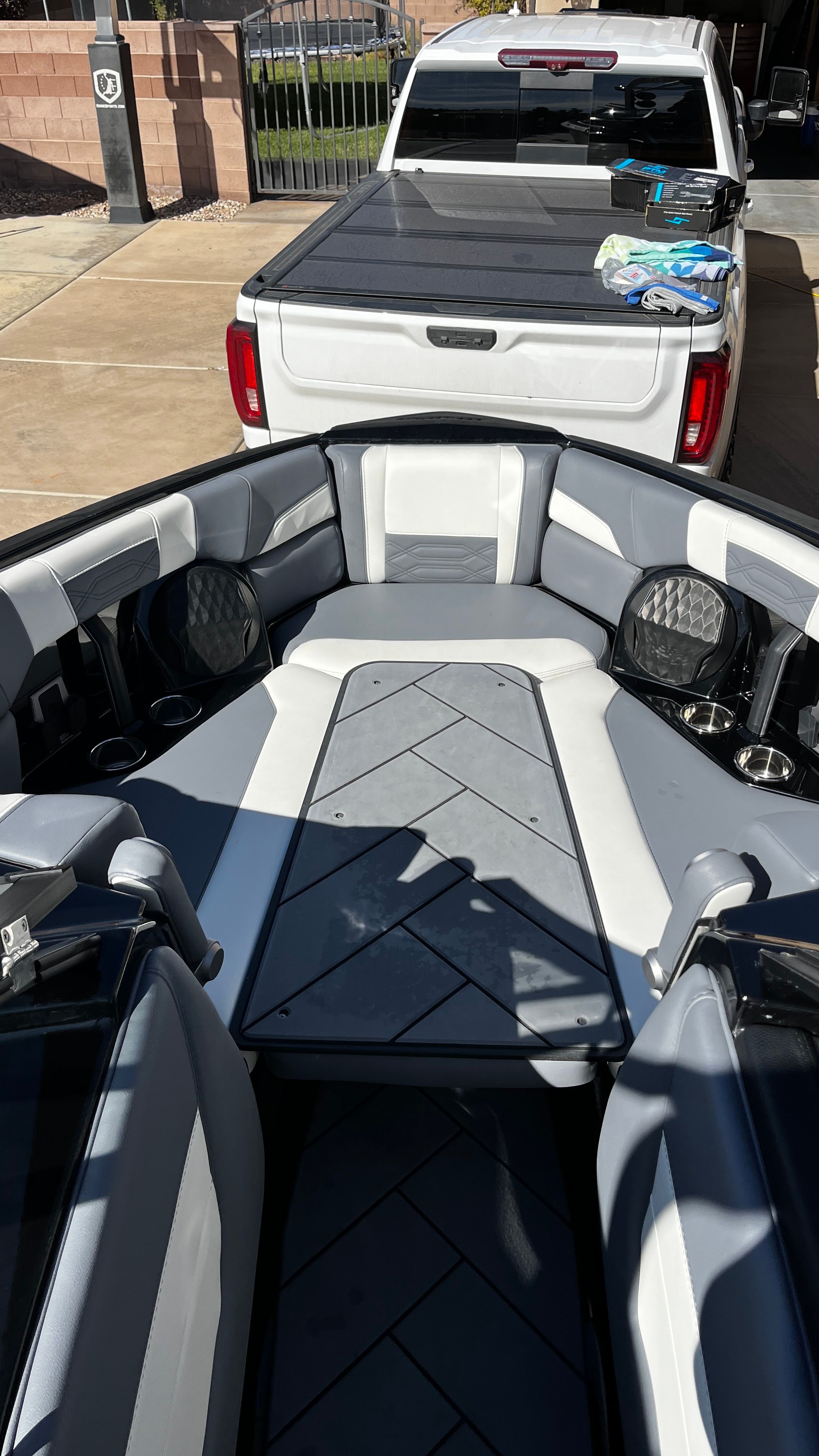 The image shows the interior of a 2023 Malibu Wakesetter 26 LSV with gray and white seating.
