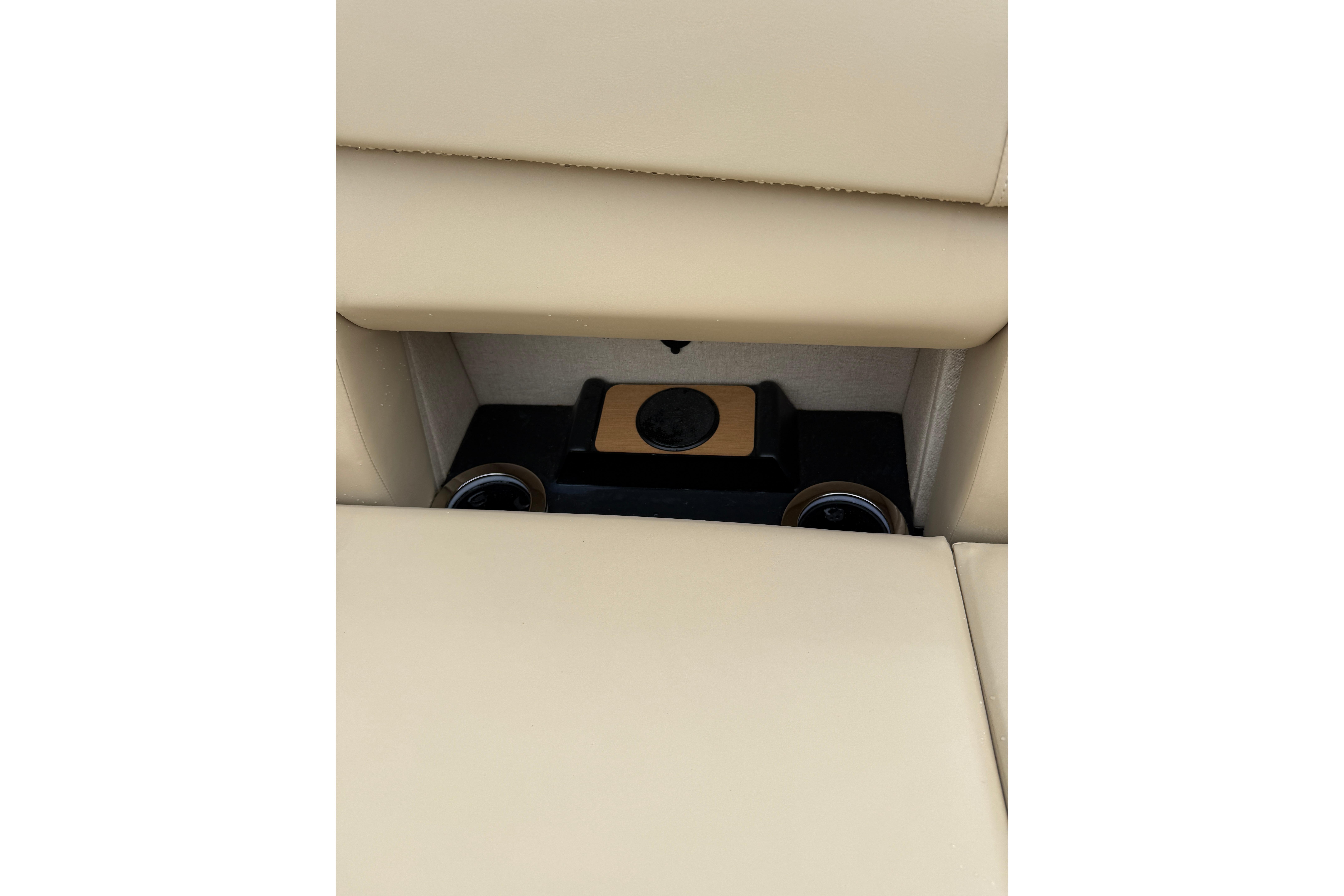 Beige interior of 2025 Balise Helix 26 L with hidden compartment and cup holders.