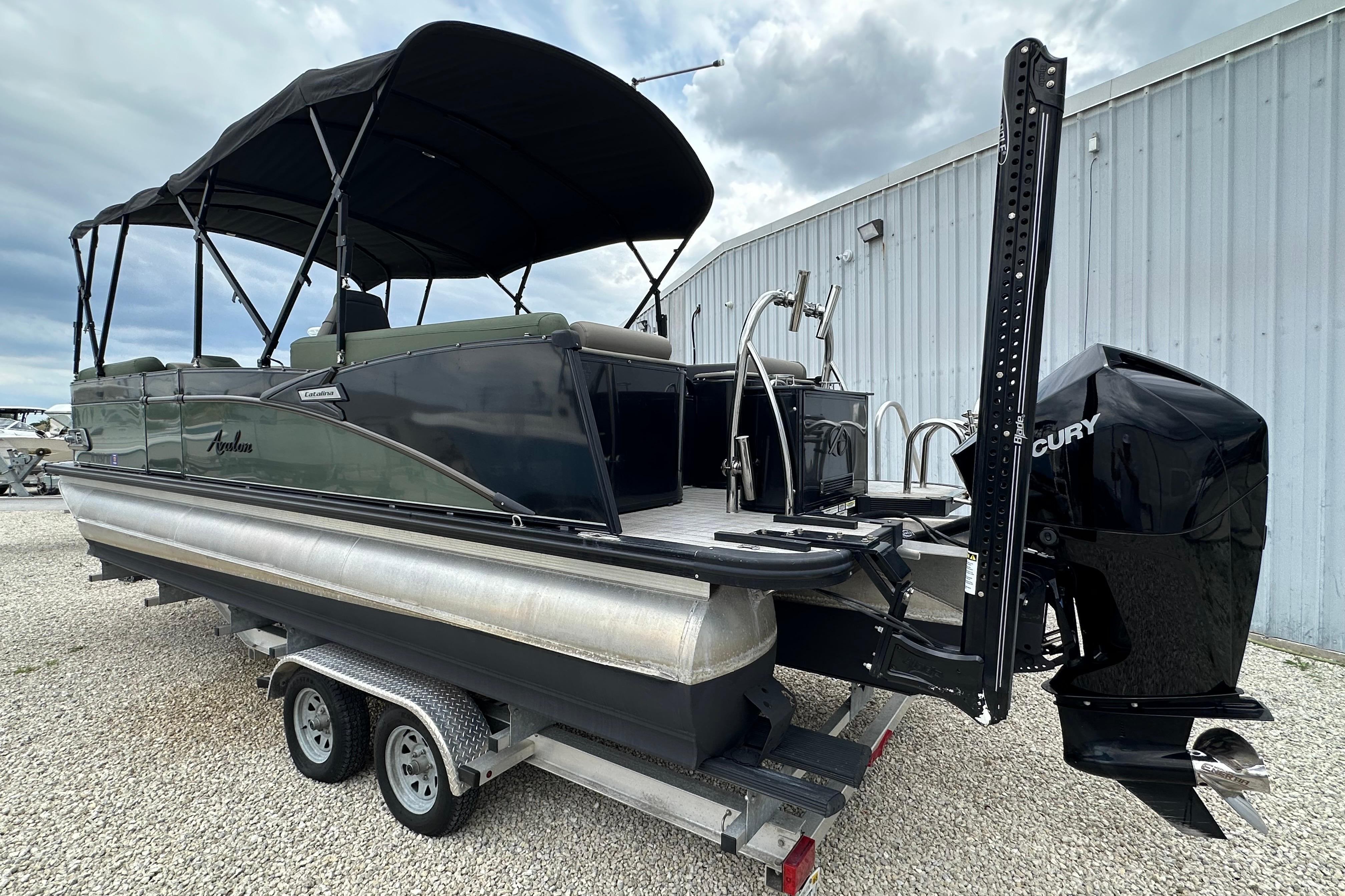2023 Avalon Catalina Quad Lounge 23' pontoon boat with Mercury engine on trailer.