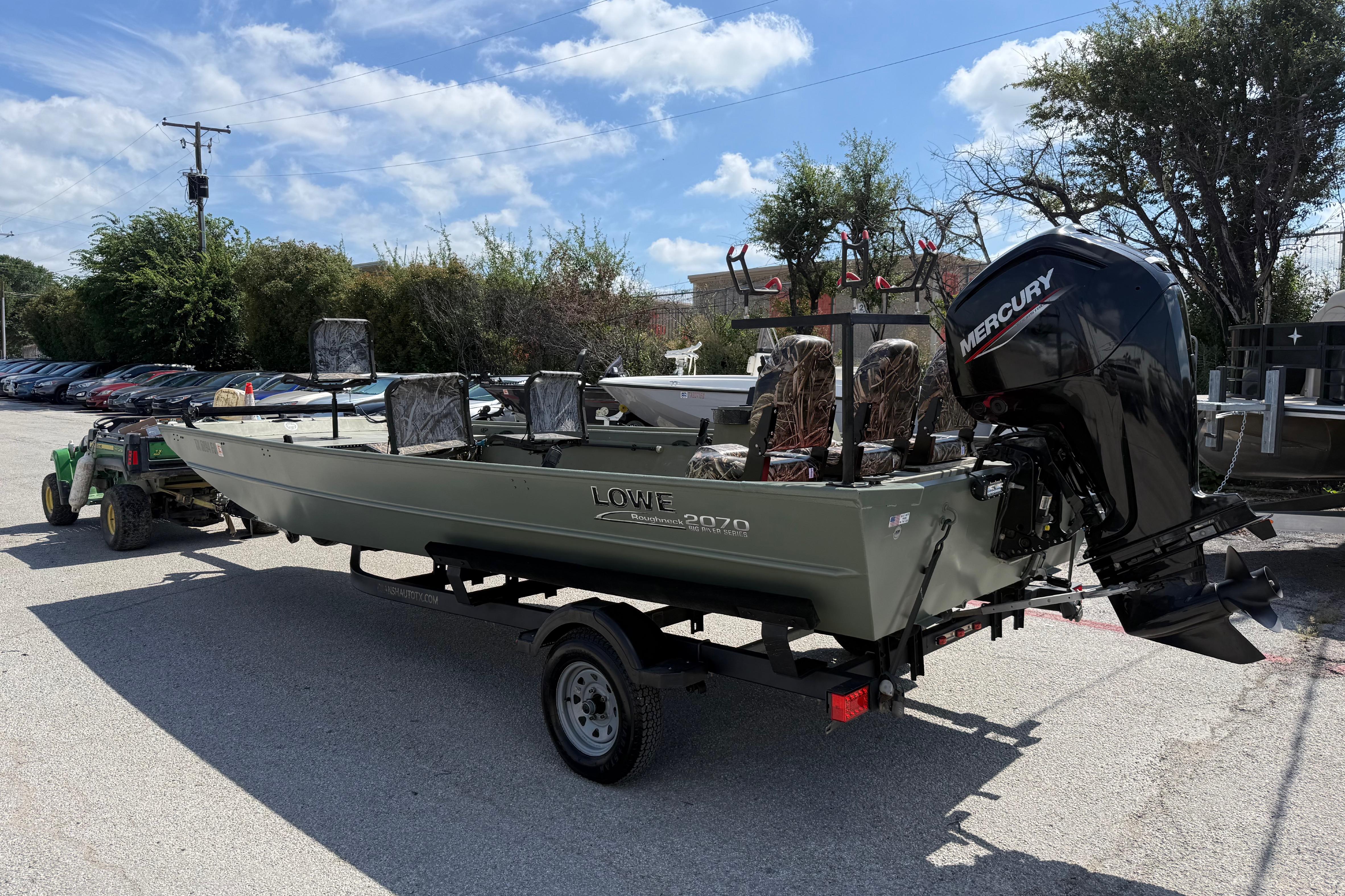 A 2020 Lowe Roughneck 2070 Big River boat on a trailer, ready for use.