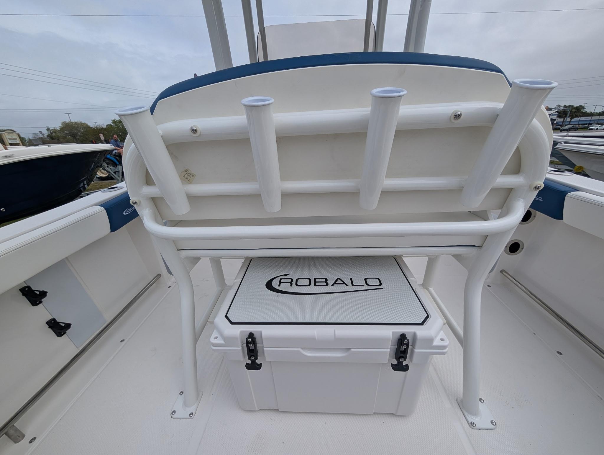 2025 Robalo R222 Explorer boat interior with rod holders and storage compartment.