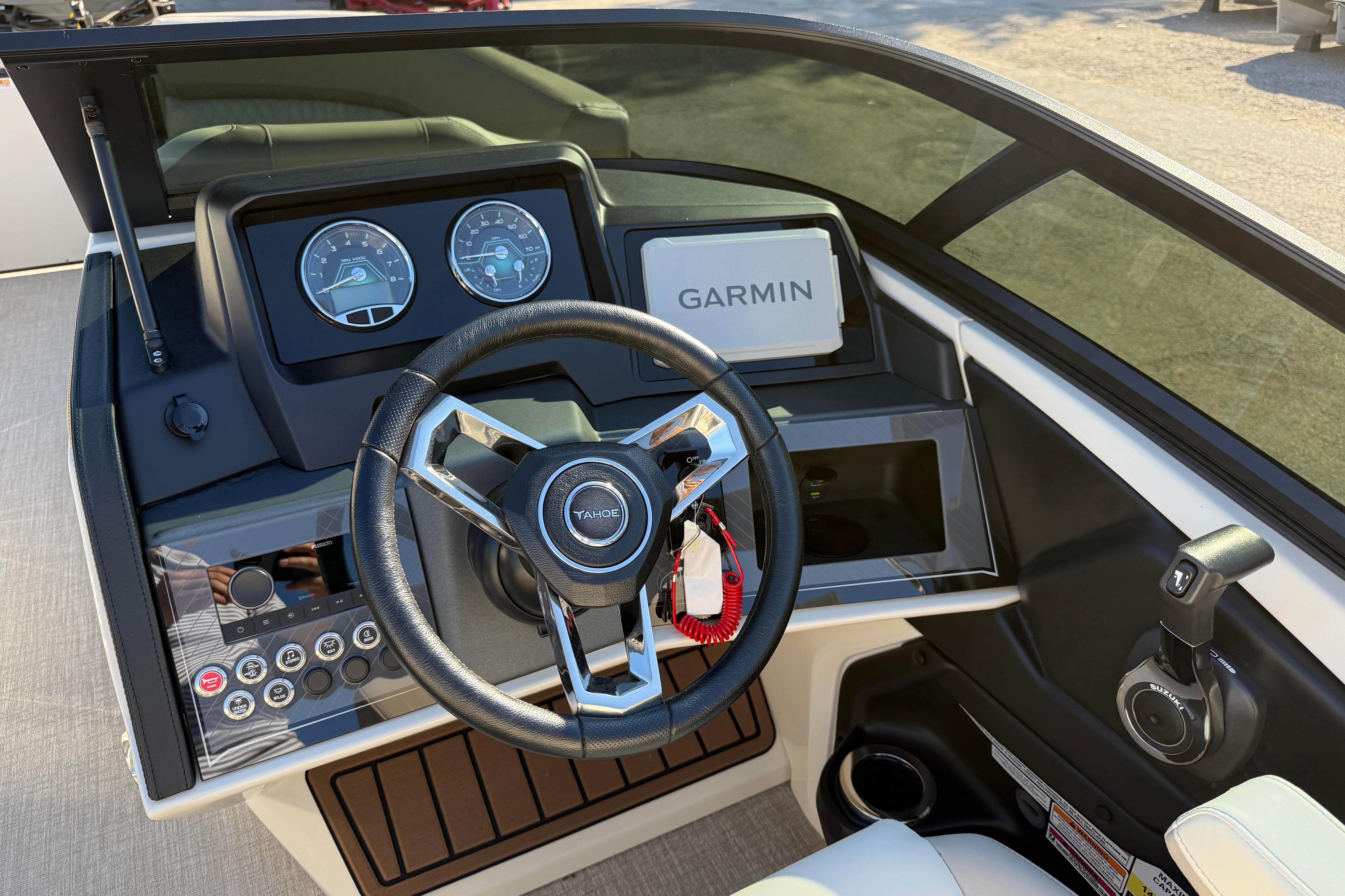 2026 Tahoe Pontoon Cascade Quad Lounger Windshield dashboard with Garmin navigation system.