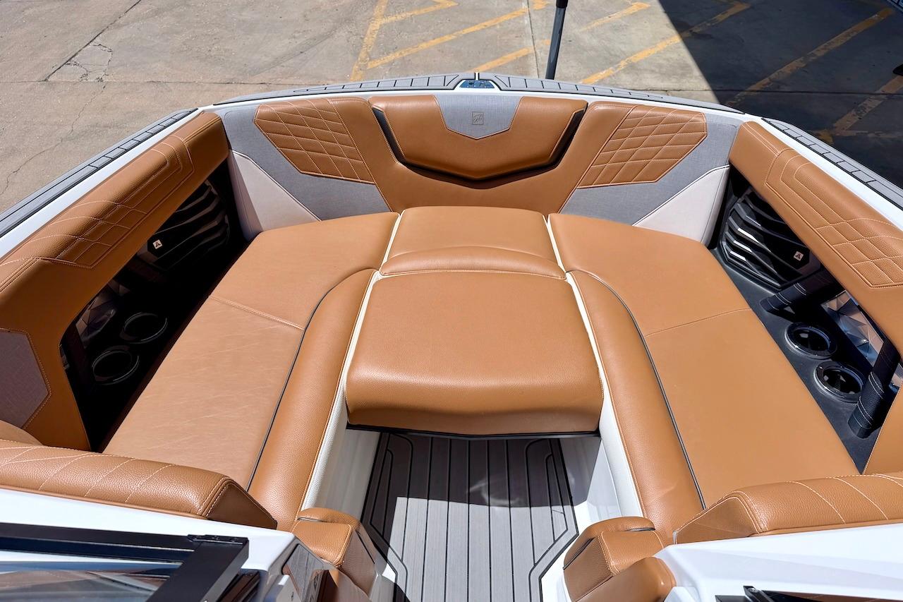 2021 Nautique Super Air Nautique G23 boat interior with tan leather seating.
