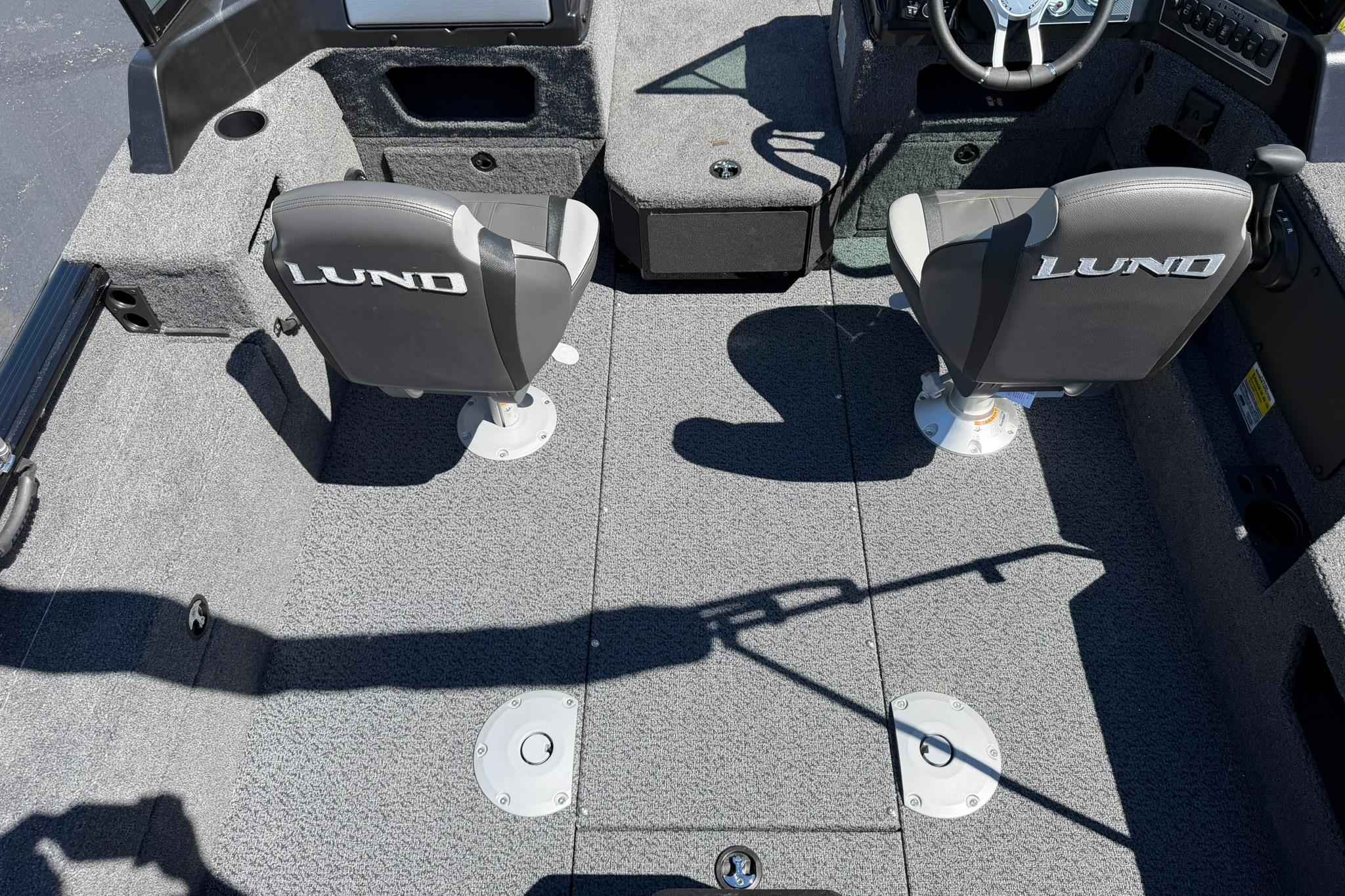 2027 Lund 1775 Impact XS Sport boat interior with two branded seats and steering console.
