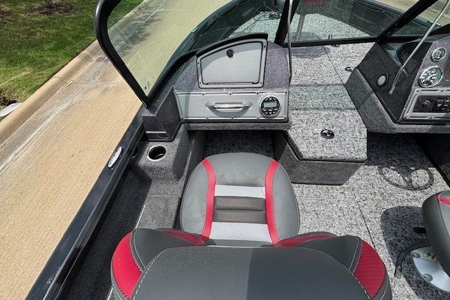 2026 Ranger VS1782SC Angler boat interior with gray and red seating, dashboard, and carpeted flooring.