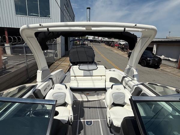 2023 Chaparral 267 SSX boat interior with white seating and open deck design.