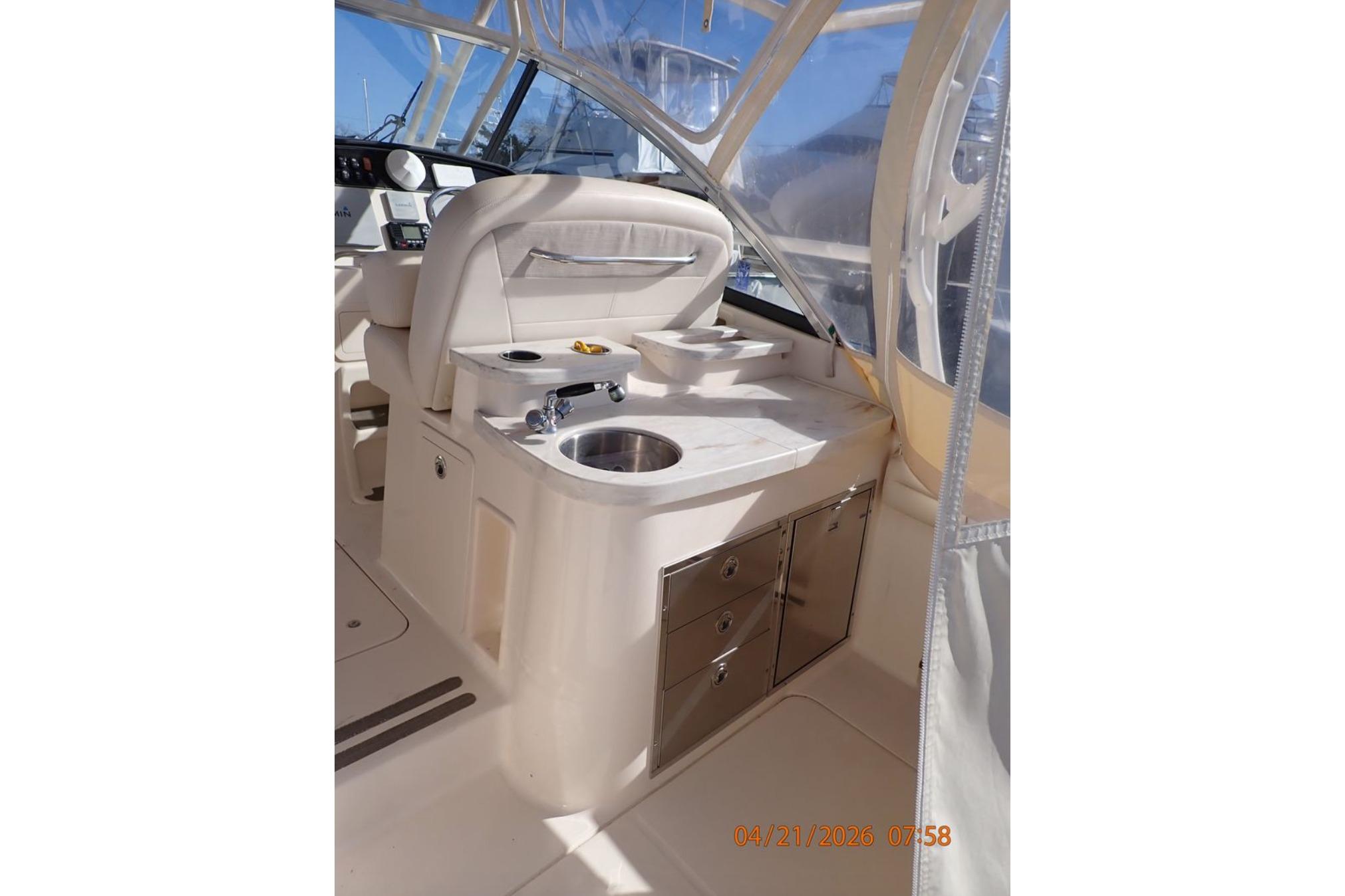 2016 Grady-White Freedom 335 boat interior with sink and storage drawers.