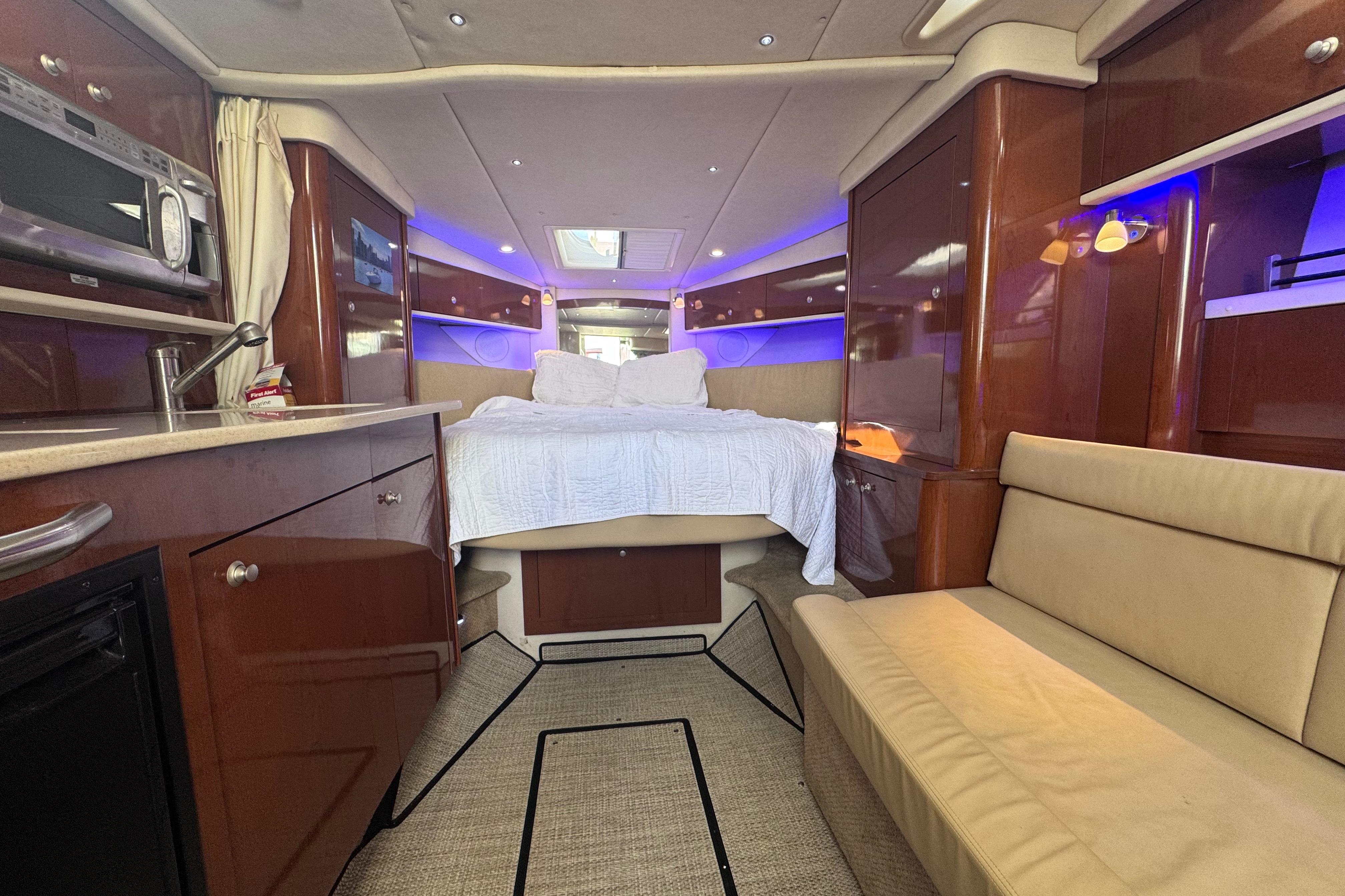 Luxurious interior of 2008 Sea Ray 350 Sundancer yacht with cozy seating and modern amenities.