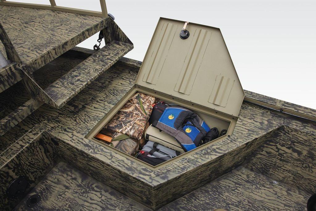 Storage compartment of 2026 Tracker GRIZZLY® 2072 CC Sportsman boat with gear and life jackets.
