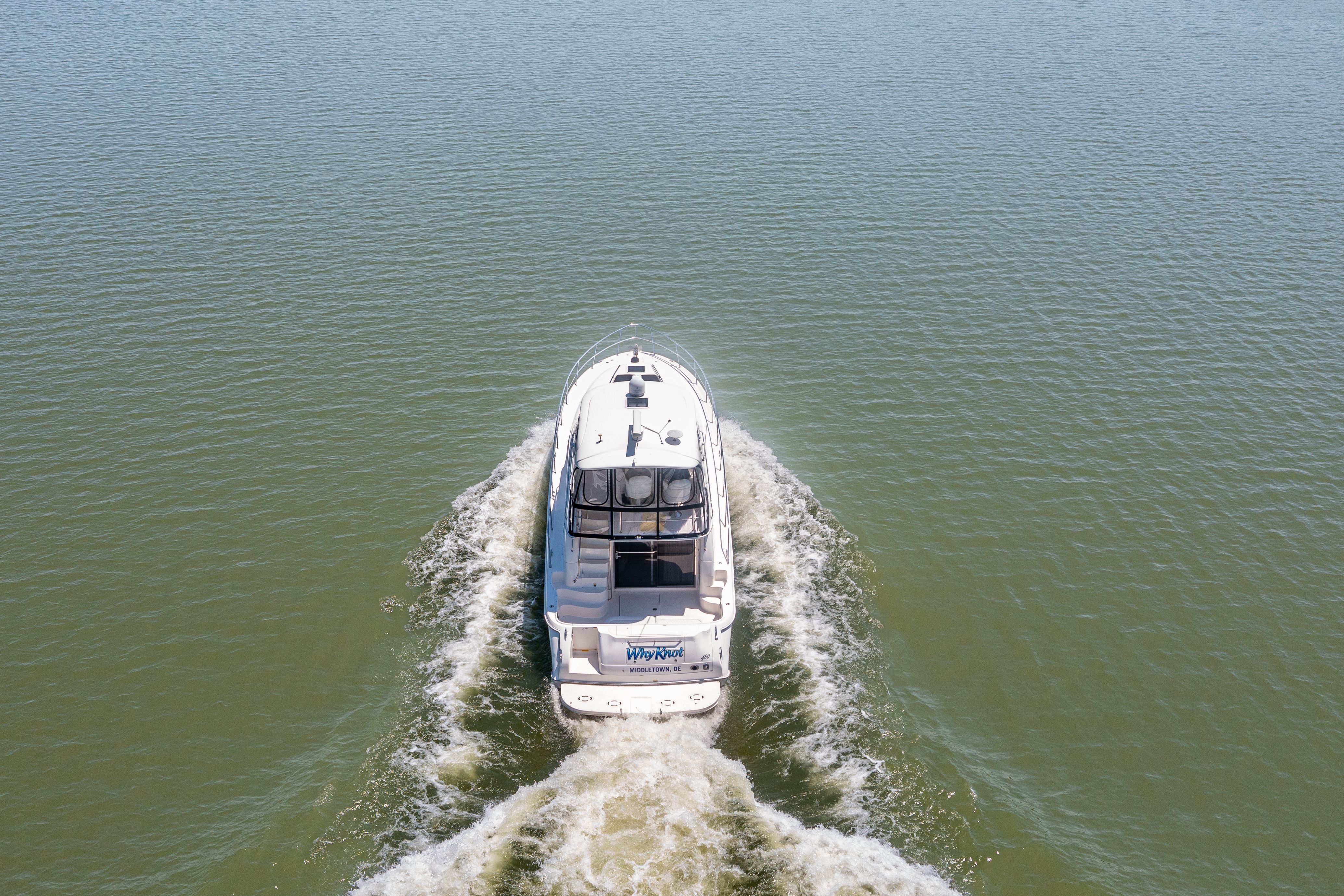 2003 Sea Ray 480 Sedan Bridge cruising on calm waters.