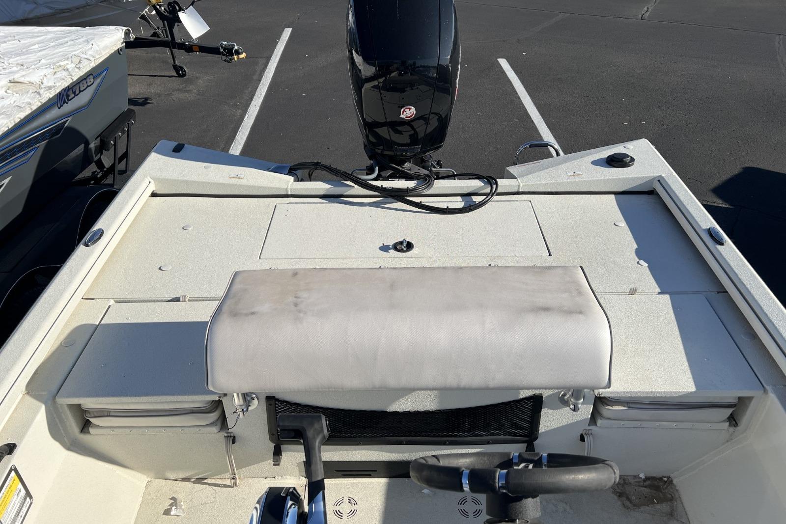 2024 Ranger RB200 boat interior with motor, parked in a lot.