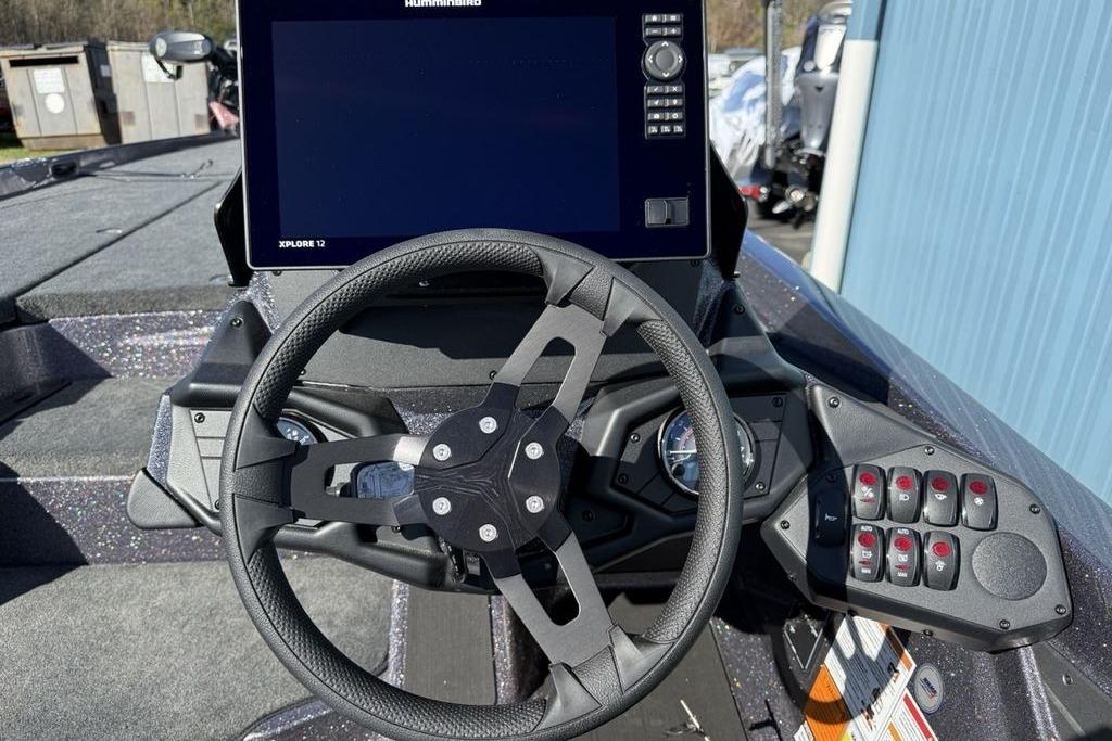 Steering console of 2026 Skeeter ZXE21 boat with advanced controls and display.