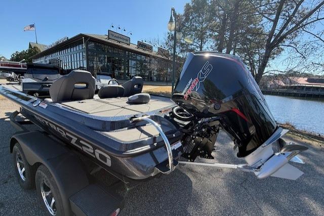 2026 Nitro Z20 XL Pro boat with powerful outboard motor, parked near a scenic lake.