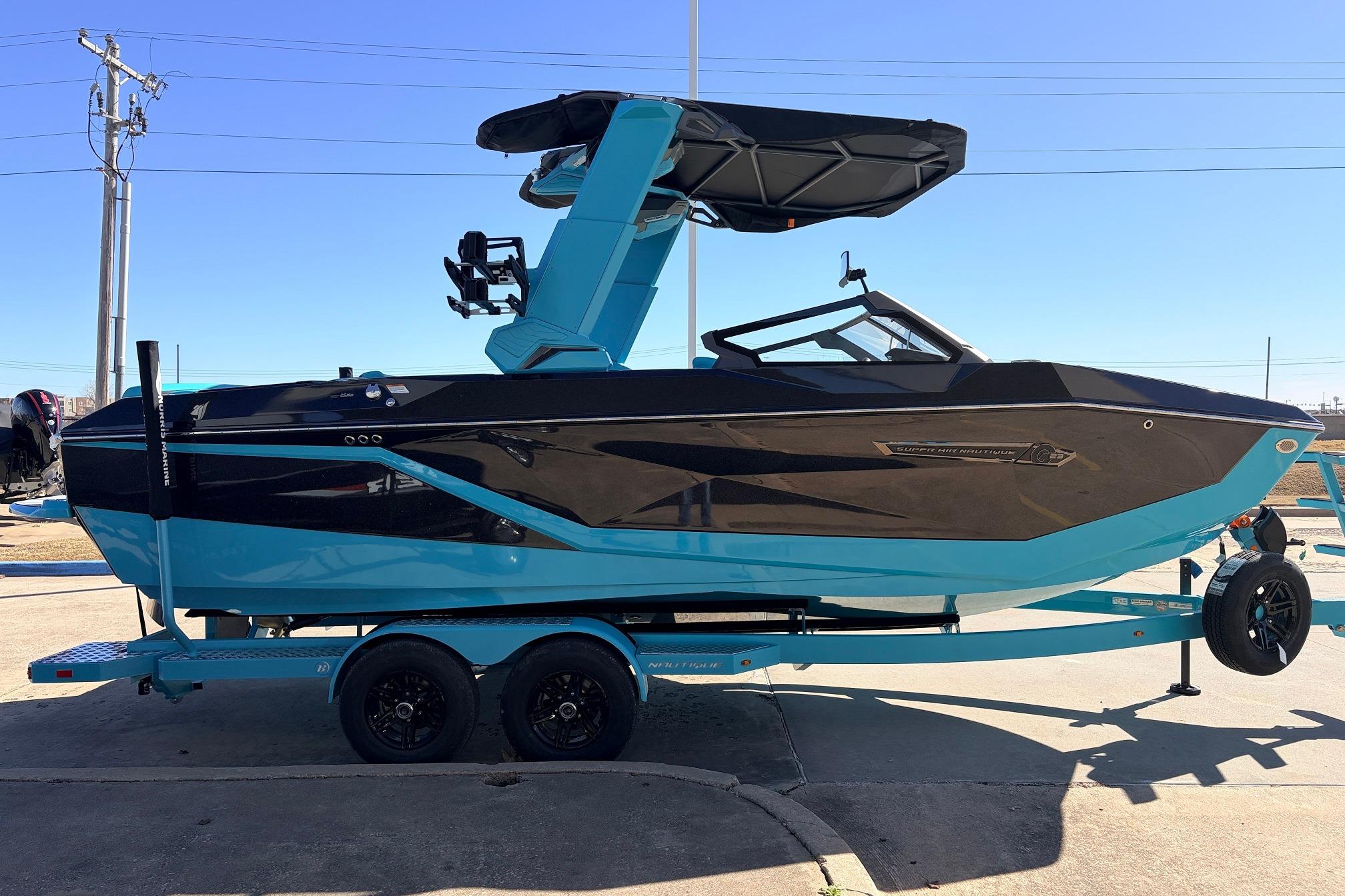 2026 Nautique Super Air Nautique G23 boat in blue and black on a trailer.