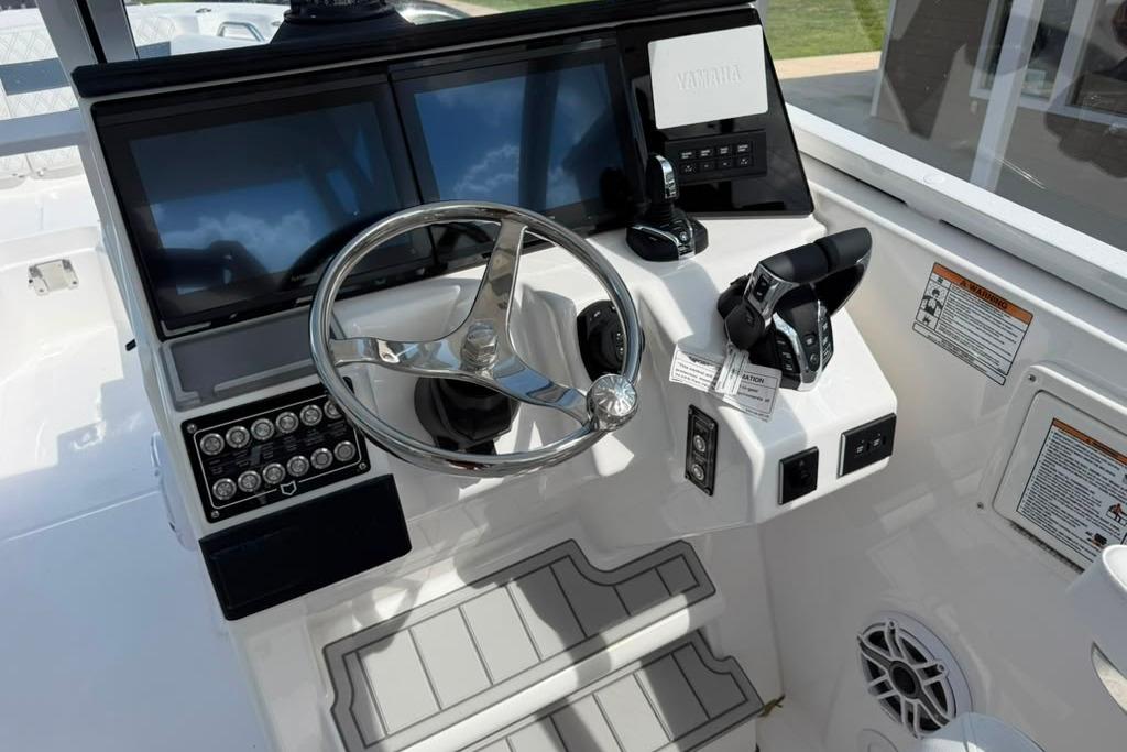 Helm of 2026 Sea Fox 288 Traveler with dual screens and modern controls.