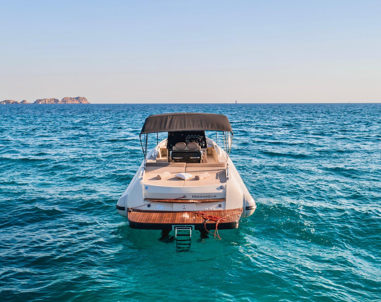 Luxury boat on clear blue ocean, sunny day, Scanner Envy 1100, 2020 model.