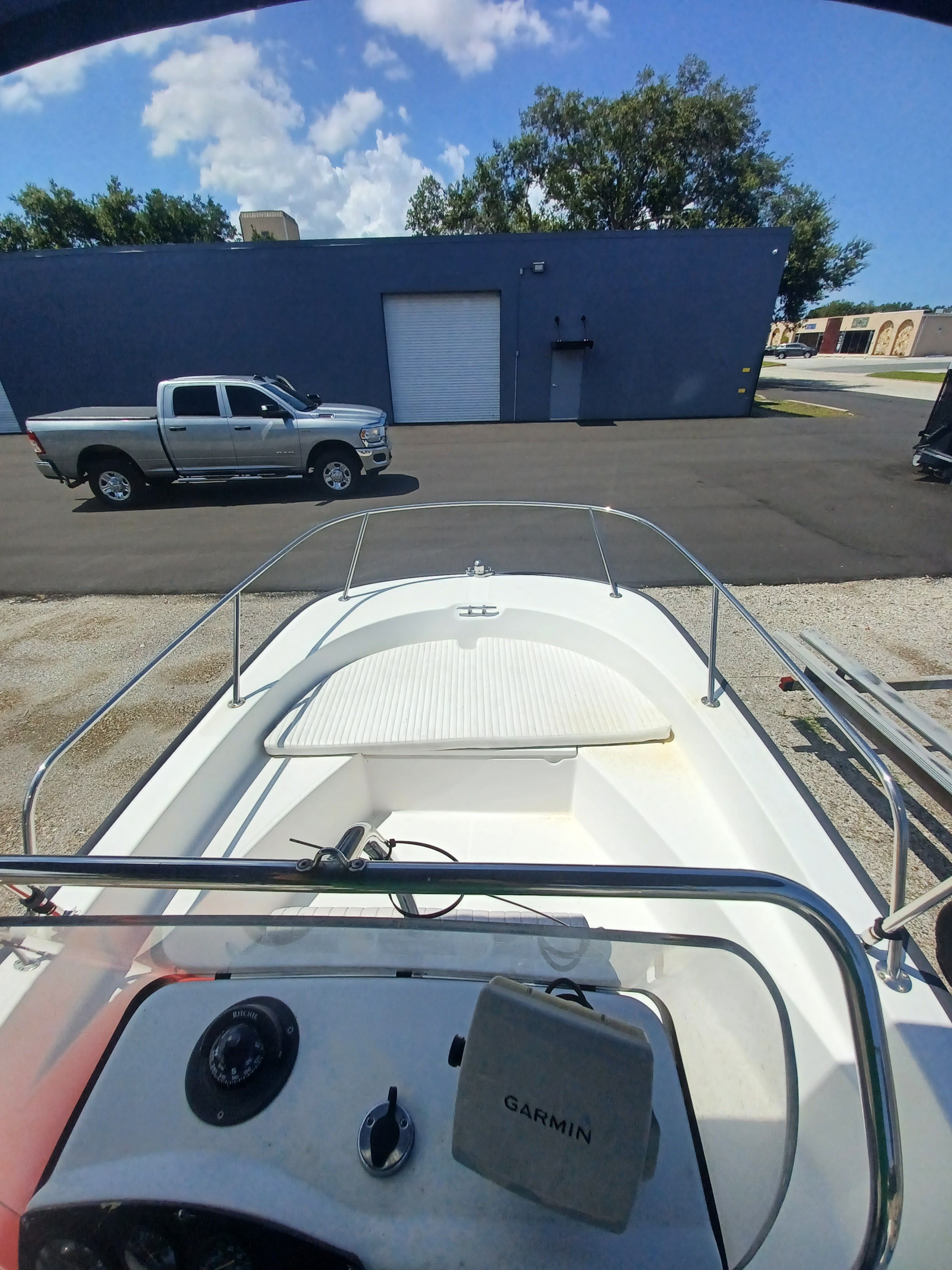 A 2008 Boston Whaler 170 Montauk is parked. A pickup truck is visible in the background.