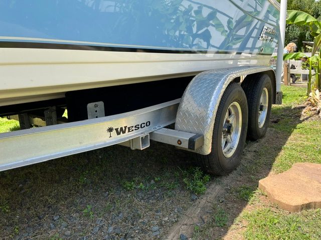 A 2022 Carolina Skiff 21 Ultra Elite on a Wesco trailer outdoors.