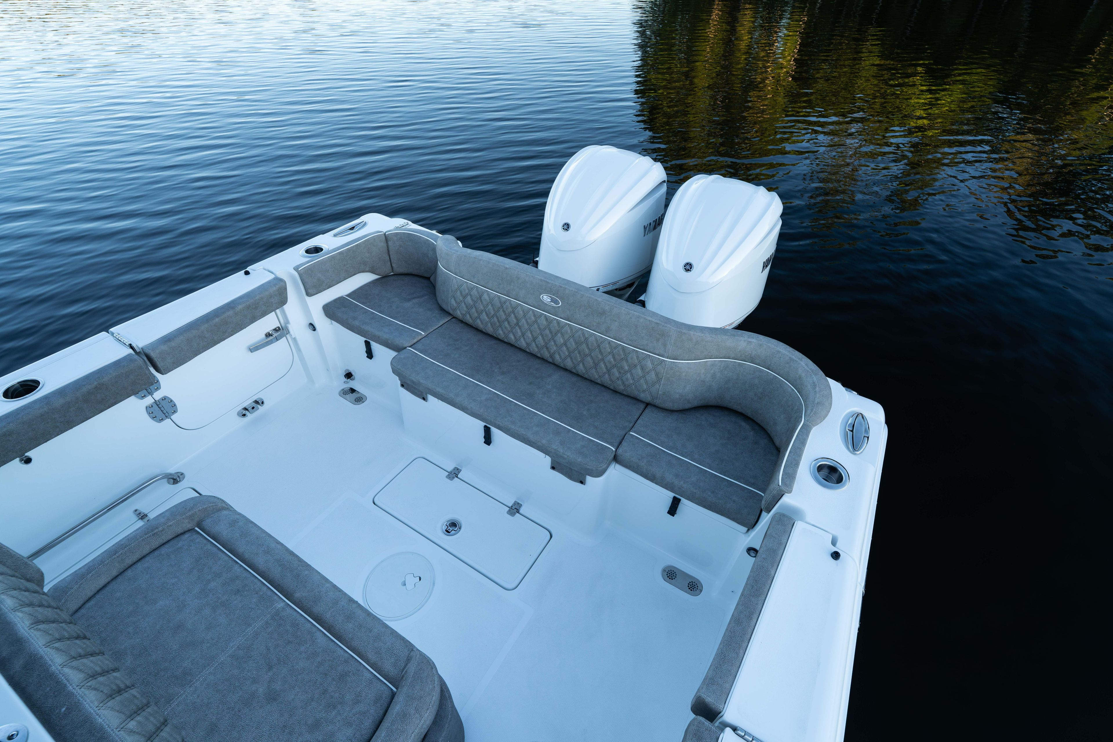 2026 Sea Hunt Ultra 275 Coffin Box boat interior with dual engines on calm water.