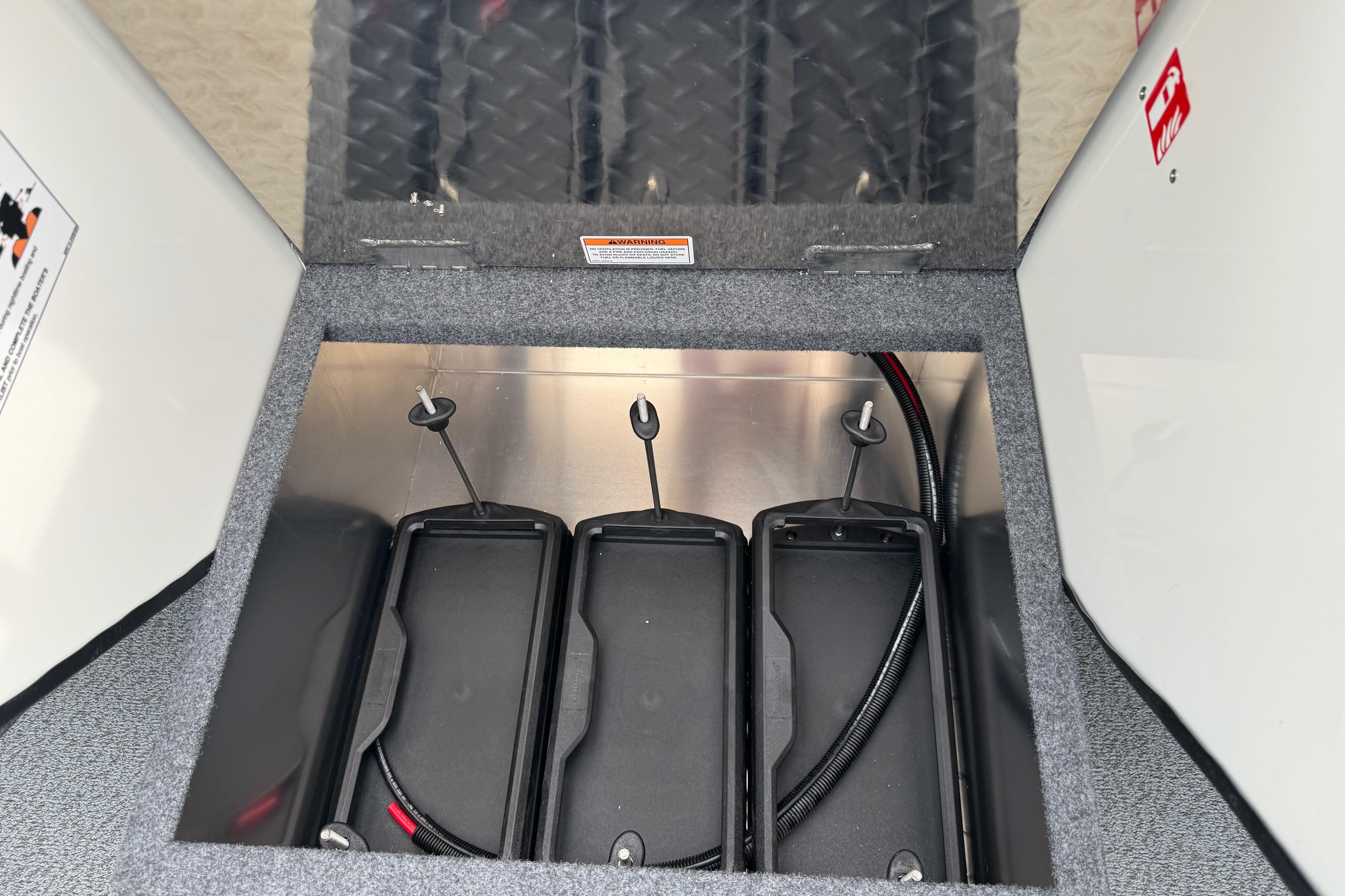 Battery compartment of 2026 Lund 185 Heavy Gauge boat, featuring secure storage.