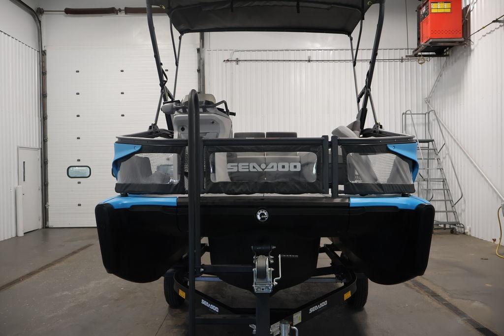 2023 Sea-Doo Switch Sport Compact in a garage, front view.