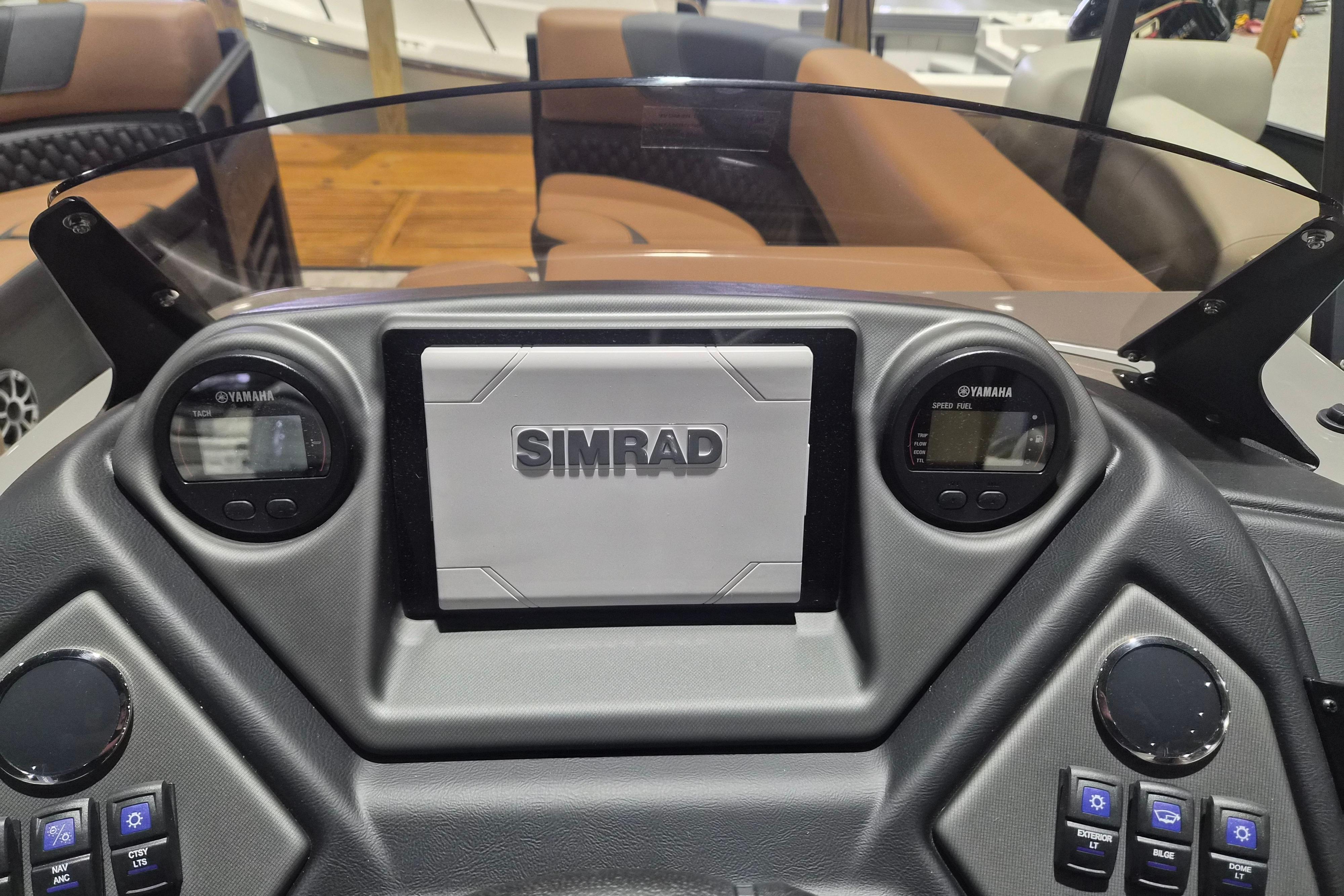 Dashboard of 2026 Sylvan L3 SLZ boat with Simrad and Yamaha displays.