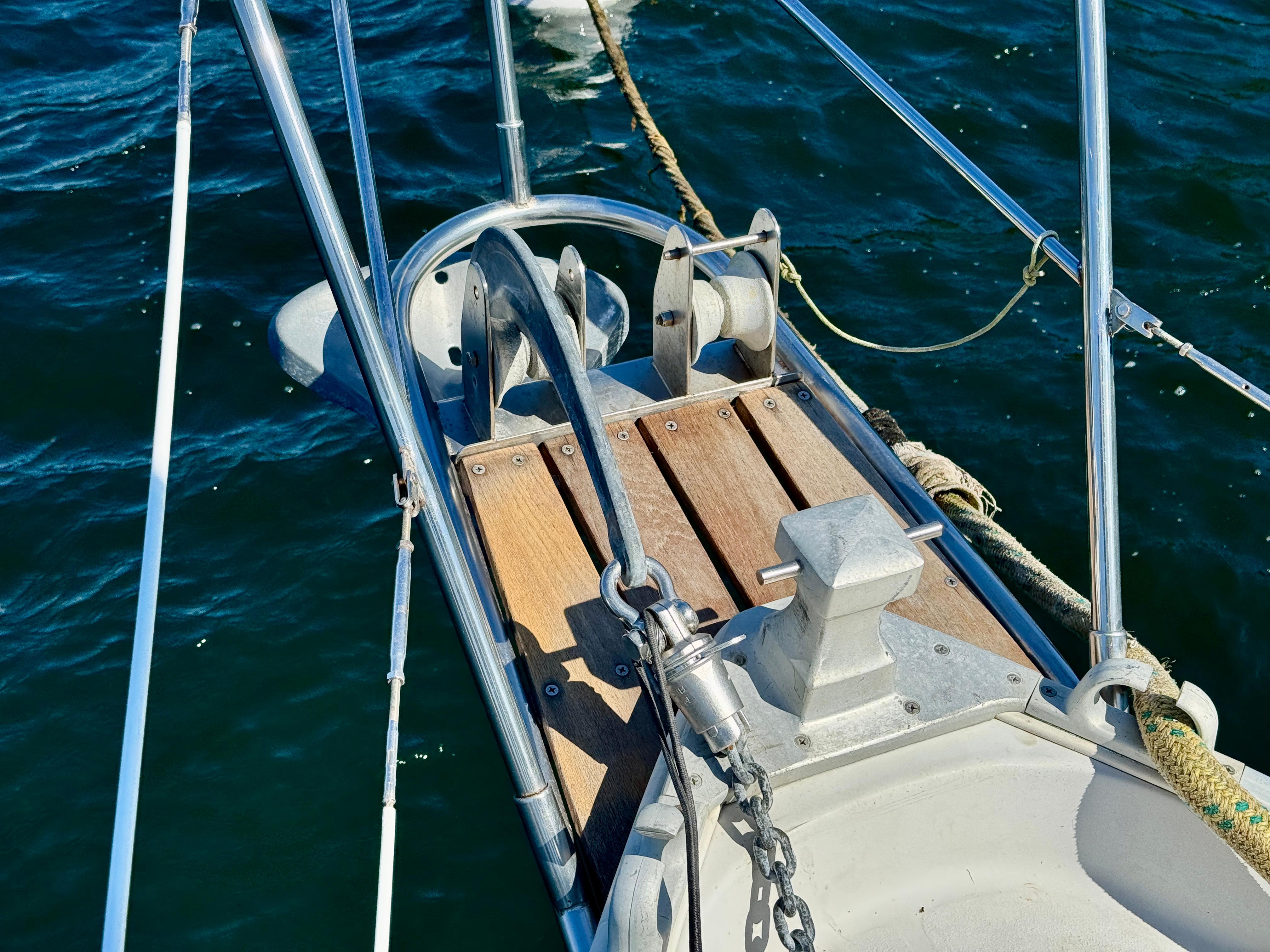 Bow of 1989 Nonsuch 30 Ultra sailboat with anchor and chain on deck.