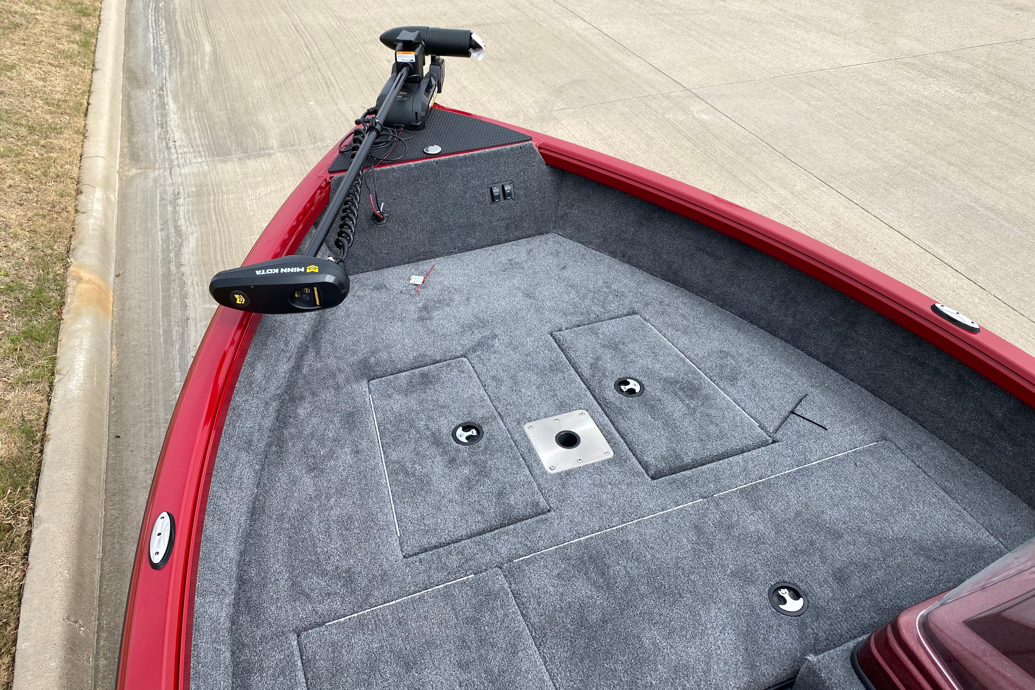 2026 Ranger VS1665SC boat with red exterior and gray carpeted deck.