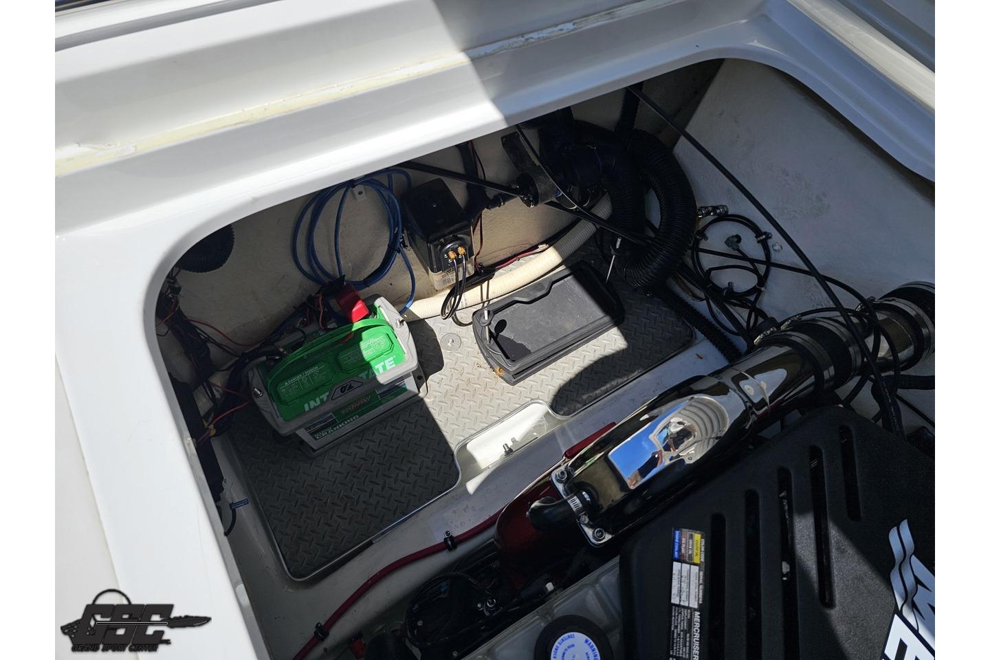 Engine compartment of a 2005 Formula 271 FASTech boat, featuring battery and wiring.