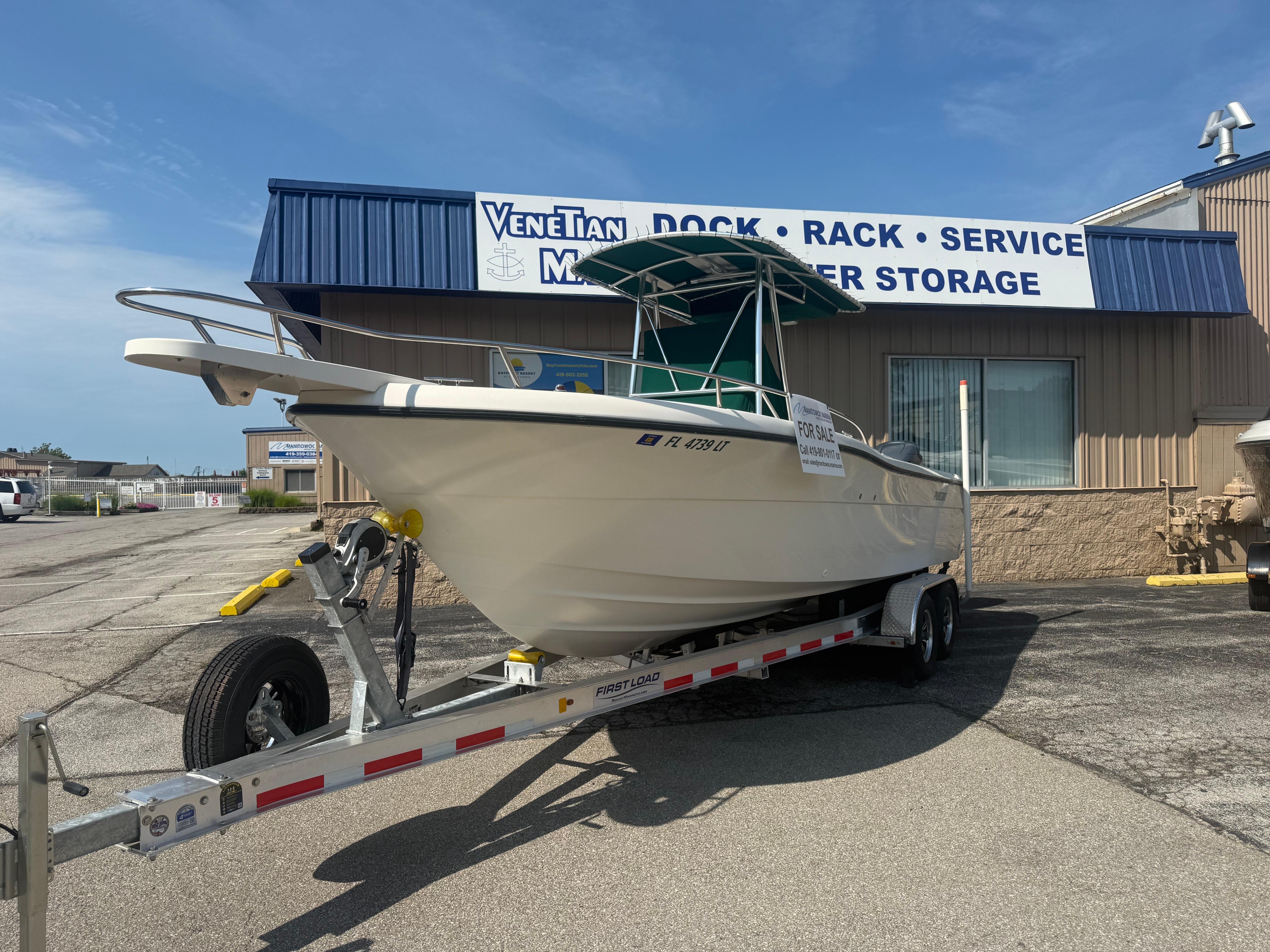 2002 Pursuit 2470 CC boat on trailer, for sale at Venetian Marine.