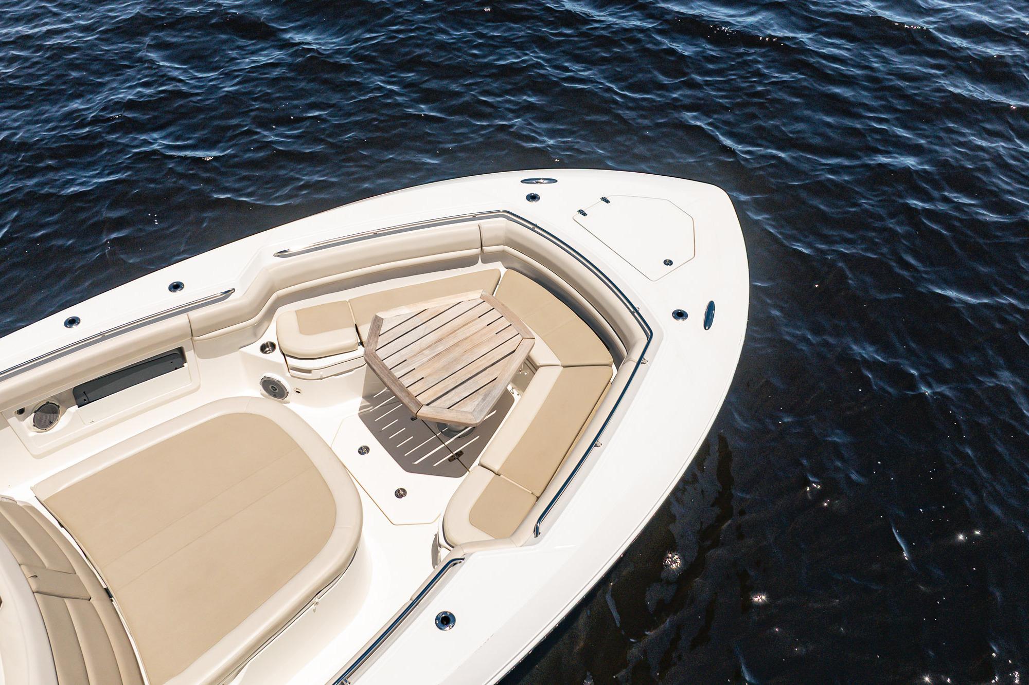 2018 Boston Whaler 380 Outrage boat with seating area on calm water.