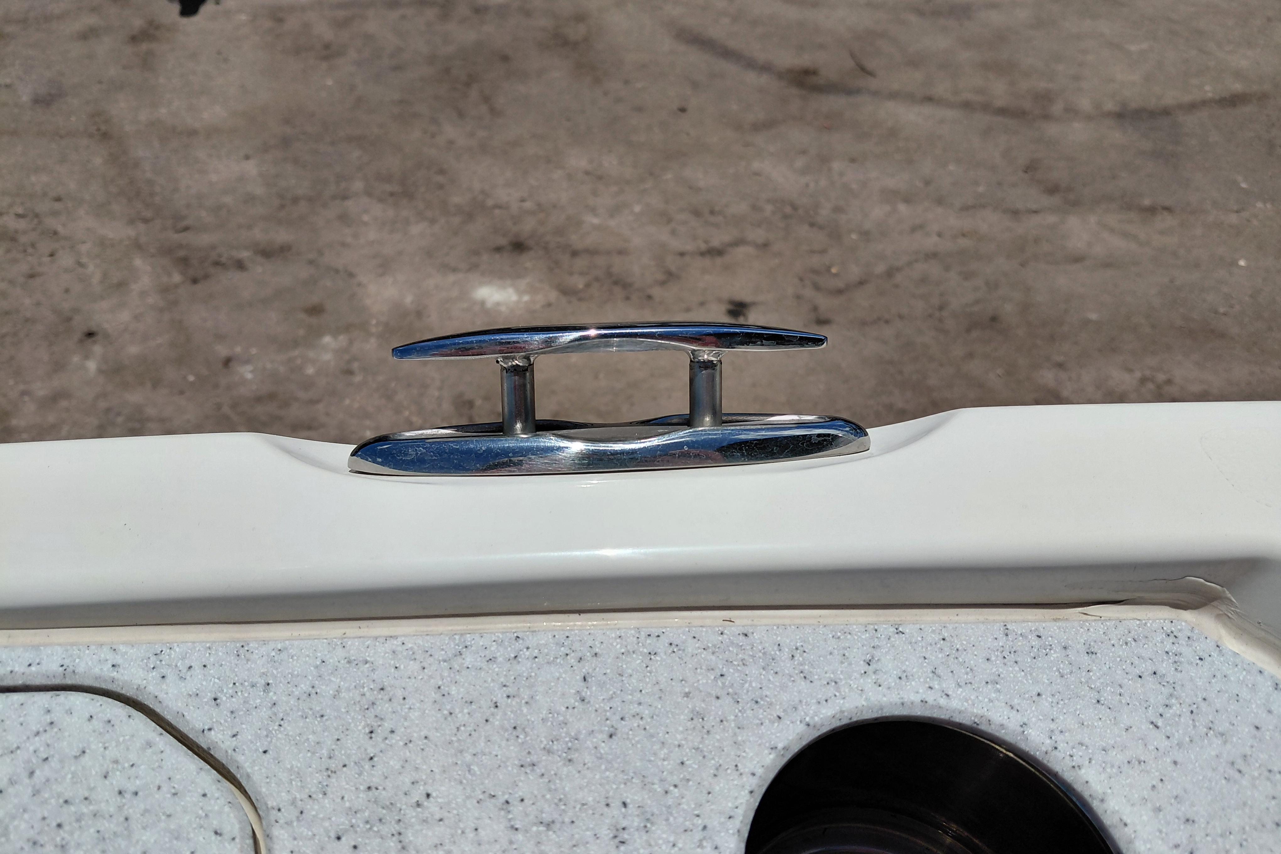 Chrome cleat on 2023 Stingray 206 CC boat deck, close-up view.
