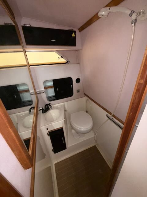 1989 Sea Ray 340 yacht bathroom with shower and toilet.