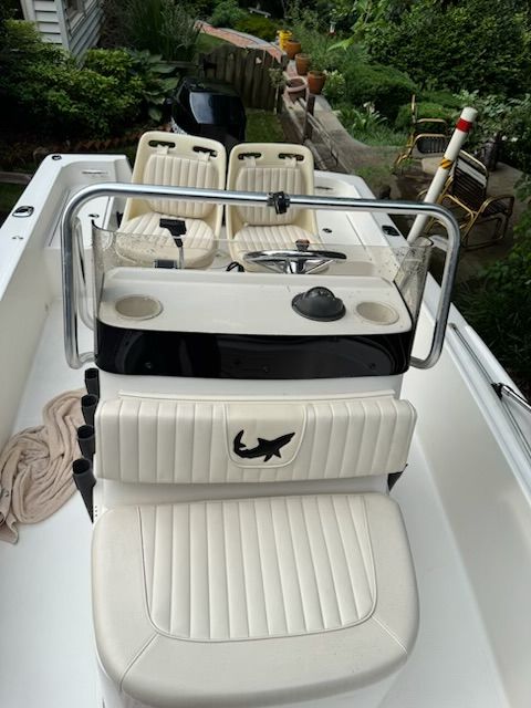 2006 Mako 171 Center Console boat with white interior.