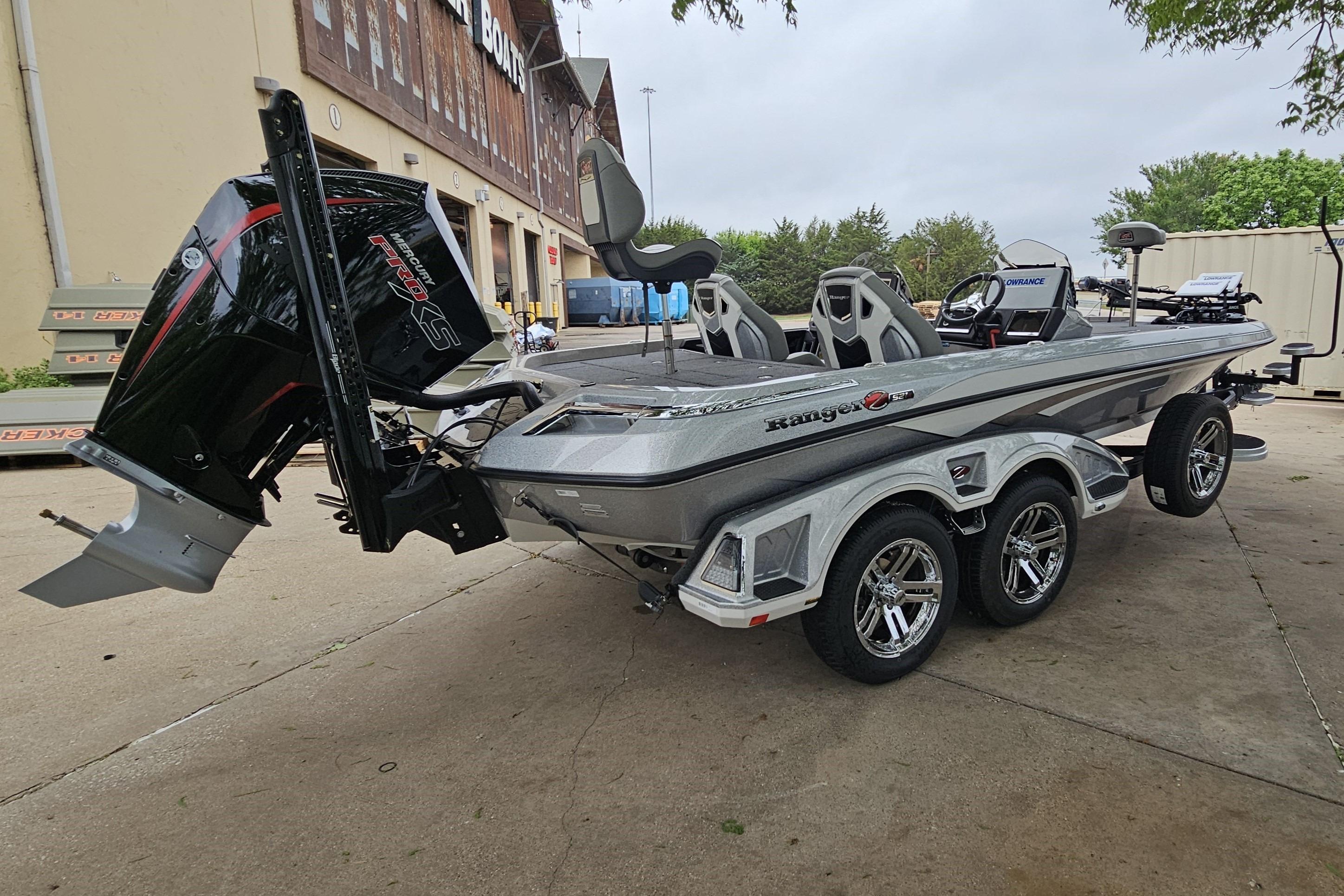 2026 Ranger Z521R Cup-Equipped boat with powerful engine, parked outdoors.