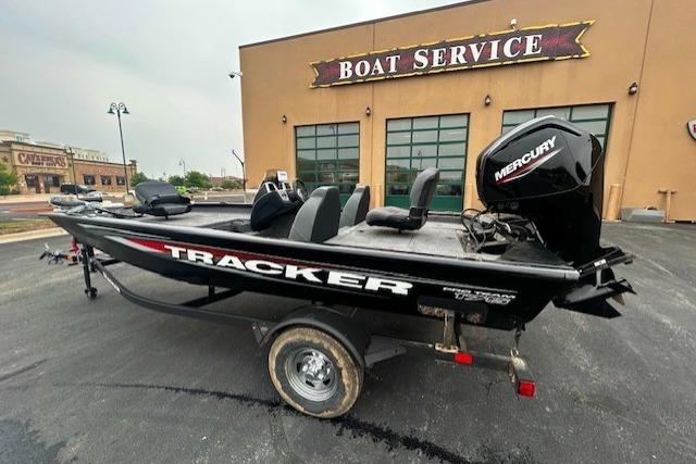 2026 Tracker Pro Team 175 boat with Mercury engine at boat service center.