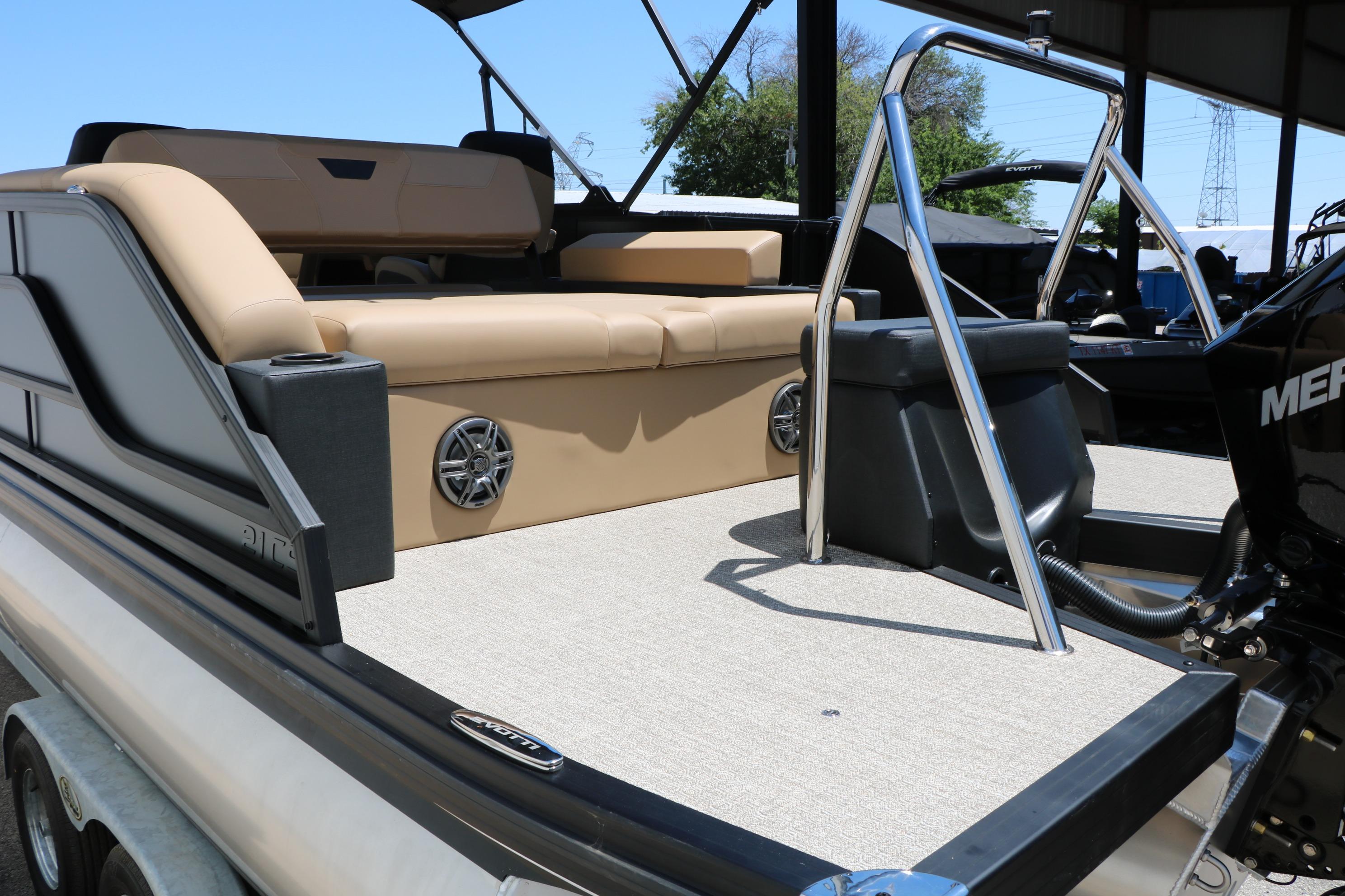 2026 Evotti 521CS boat interior with beige seating and chrome details.