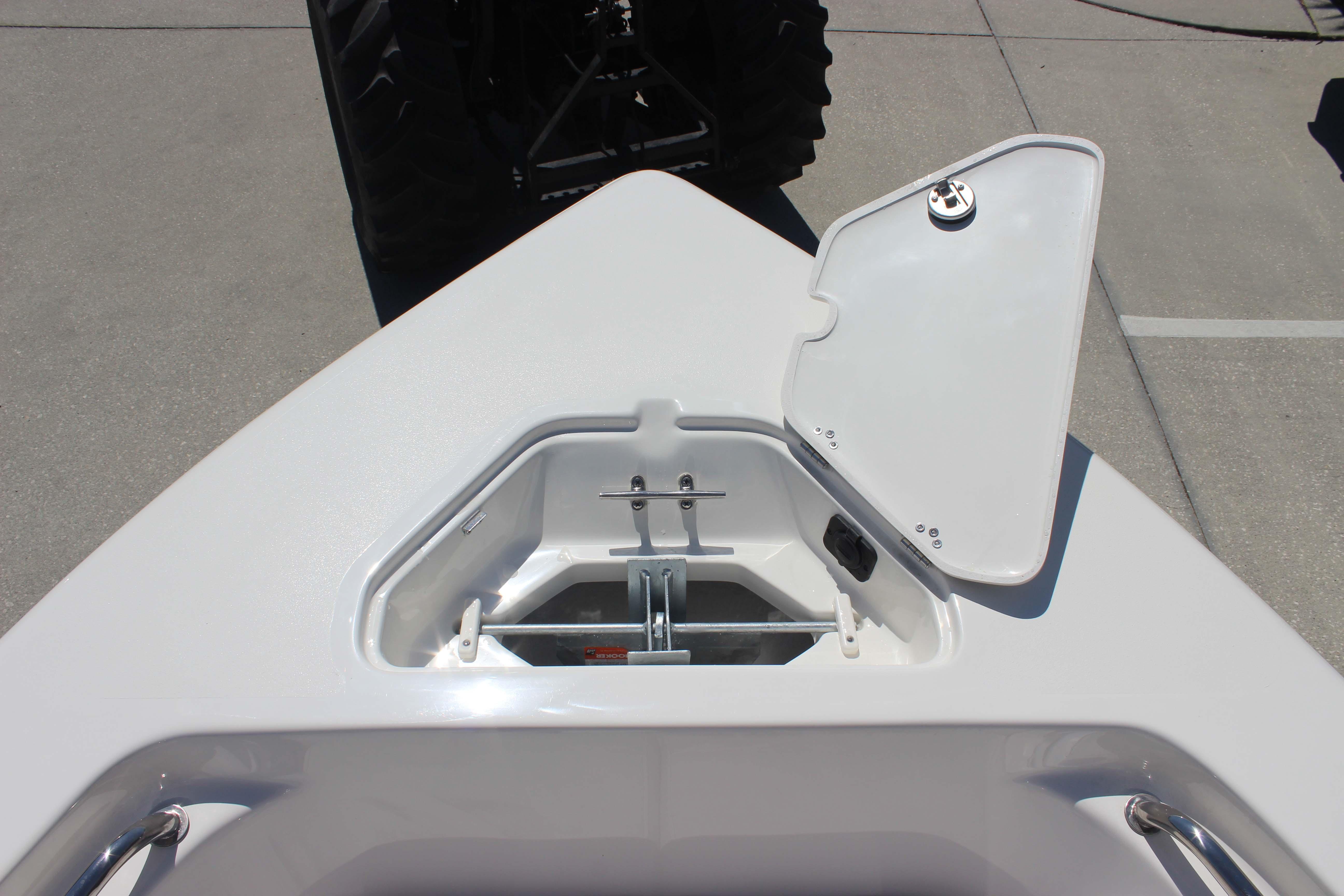 Open anchor storage compartment on 2026 Key West 203 FS boat, showcasing interior details.