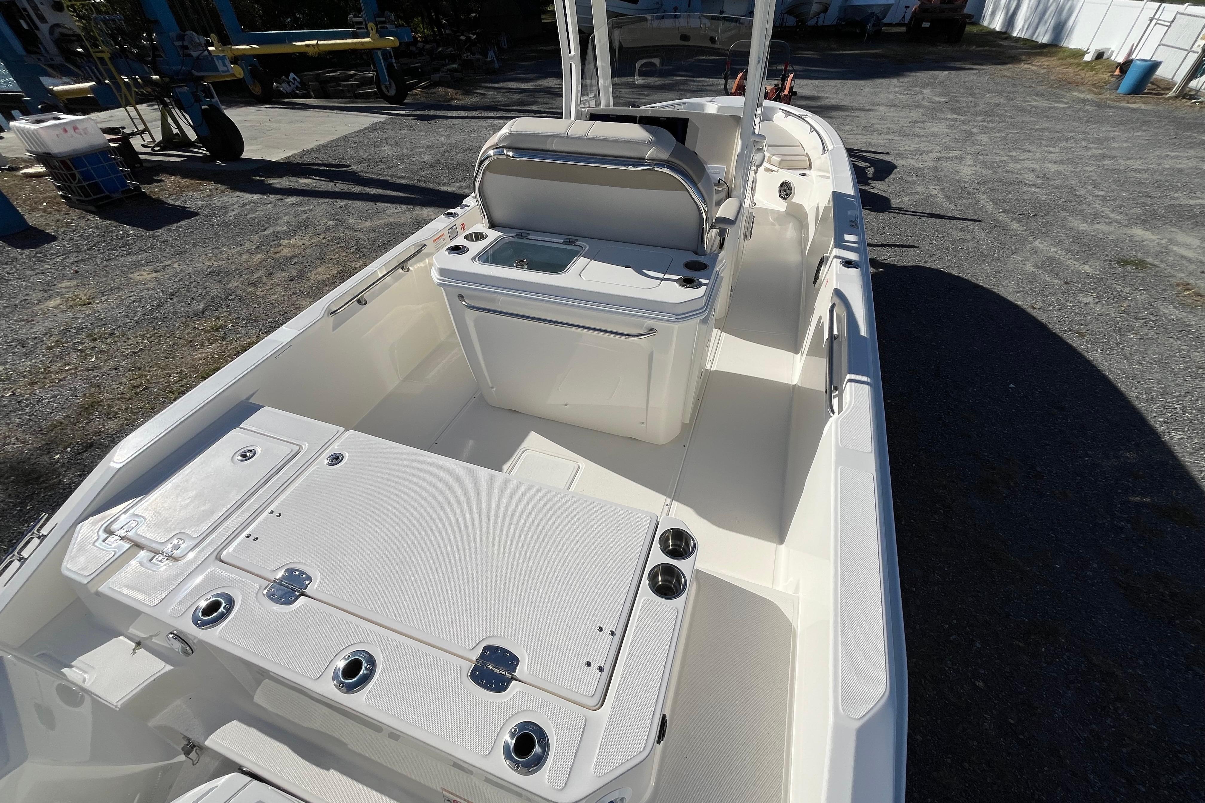 2026 Boston Whaler 280 Dauntless boat interior, featuring seating and storage compartments.