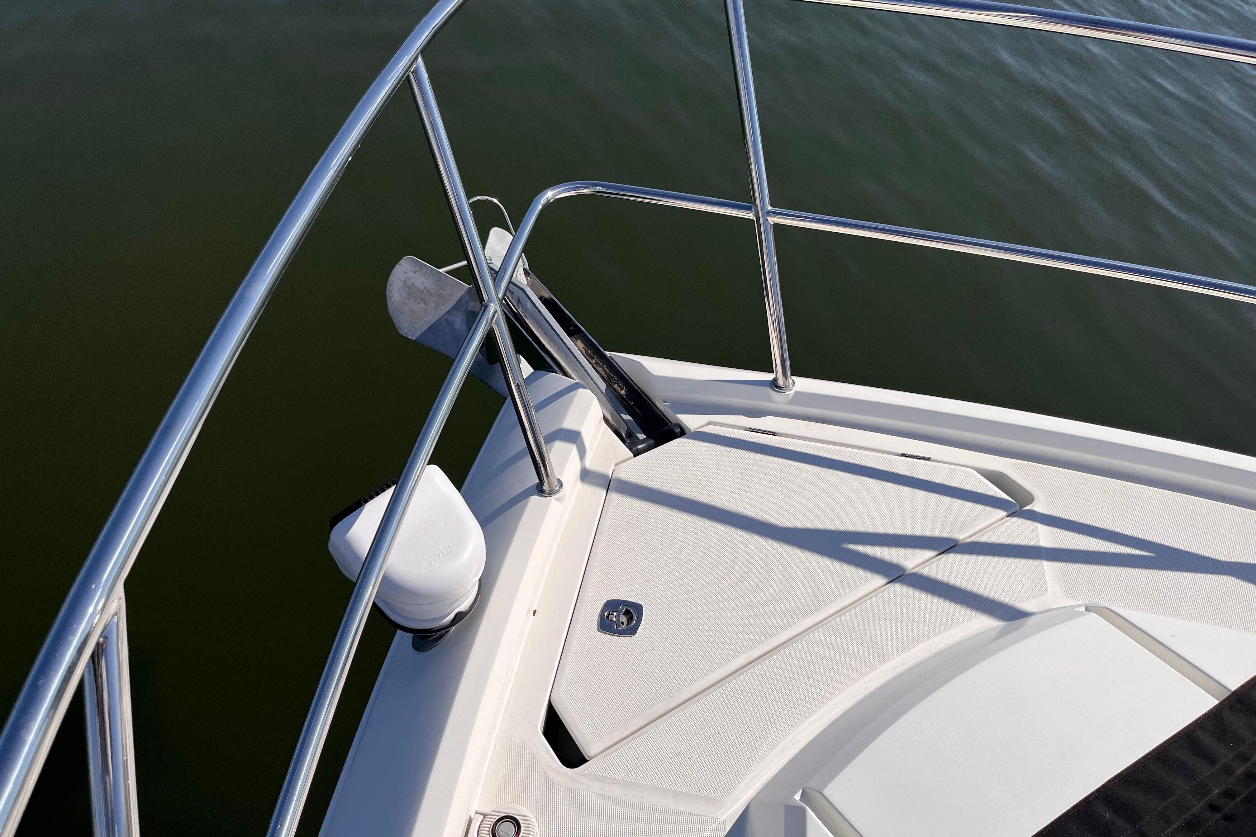 Bow of 2024 Galeon 425 HTS yacht with stainless steel railings and anchor.